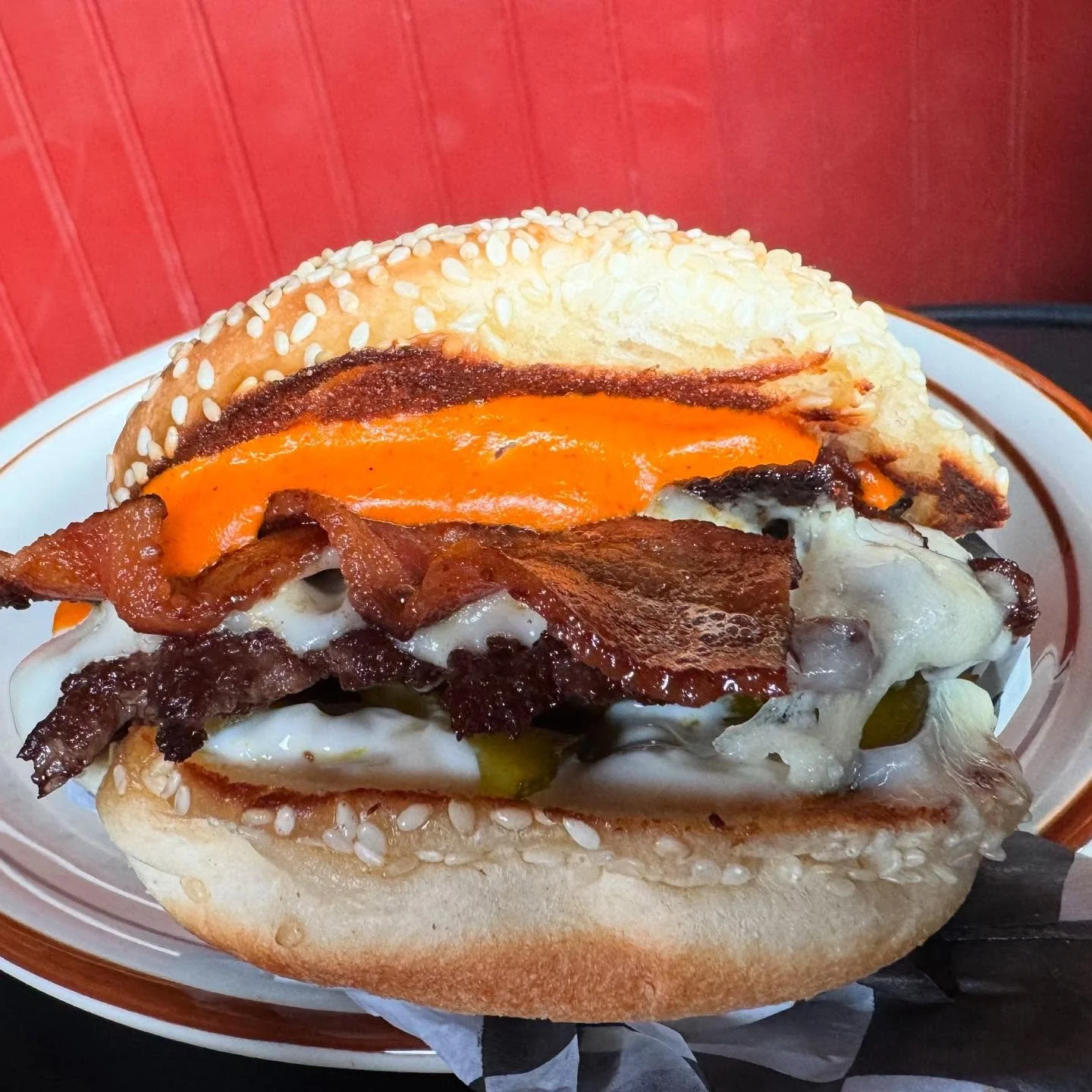 ⏰ Don’t sleep on this one, gang.  Wowza. ⏰
Bravo Burger
Bacon, Romesco, Manchego chz, pickled zucchini (from our garden), and mayo on a sesame seed bun.
It’s vurry vurry goode
