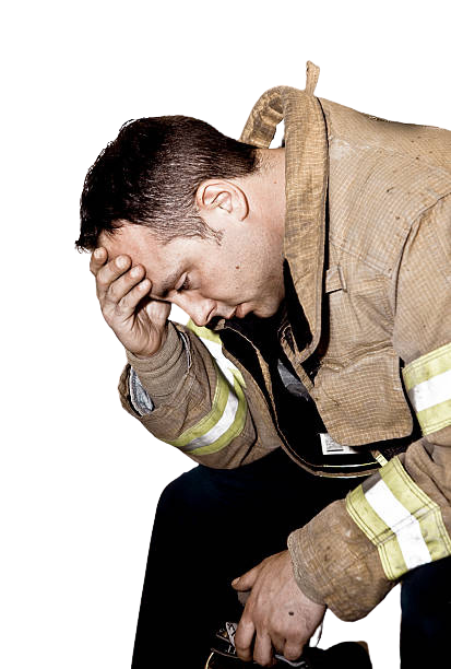 Firefighter exhausted after lift assist call highlighting risks of manual patient lifting injuries