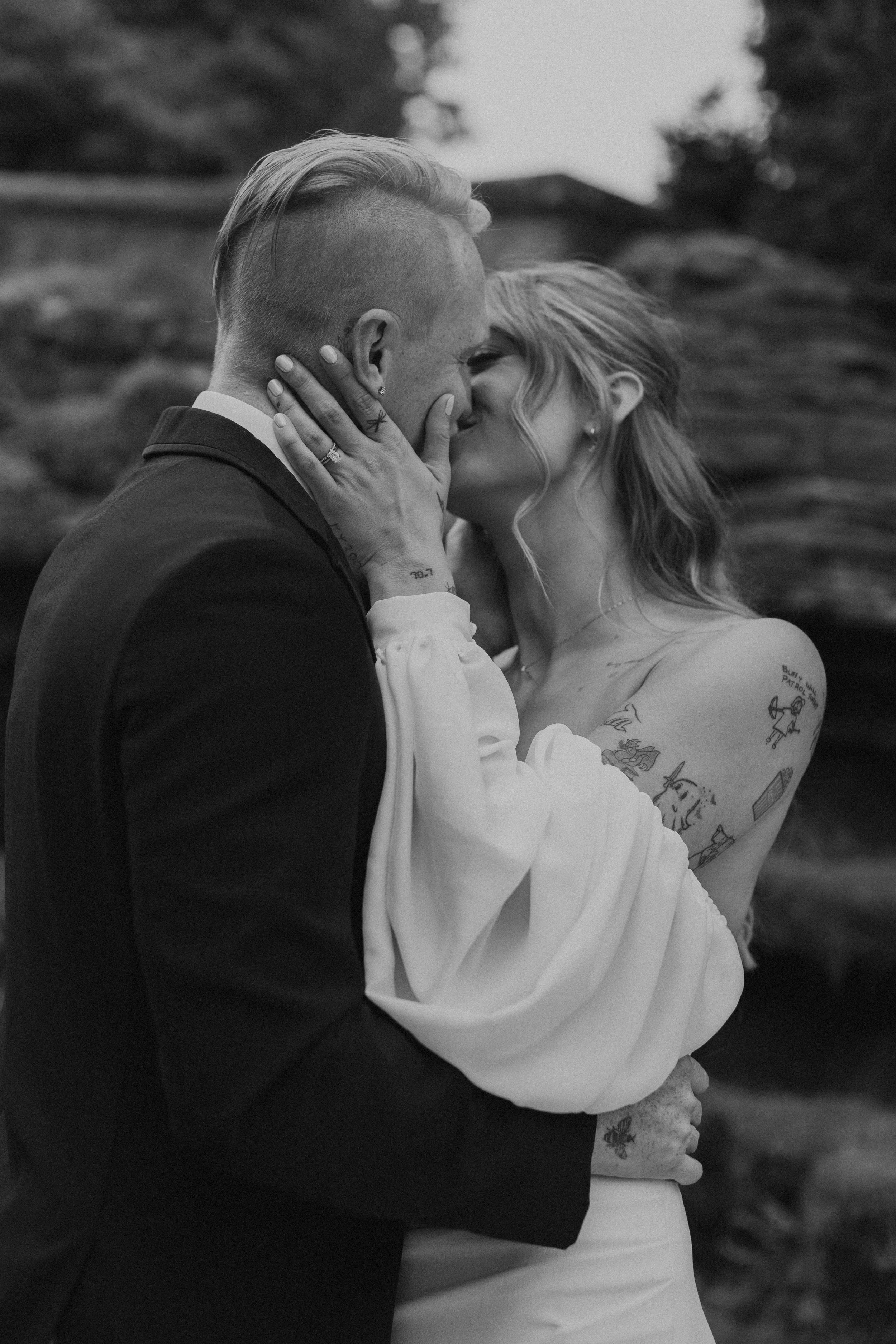 intimate close up of bridal couple embracing and kissing