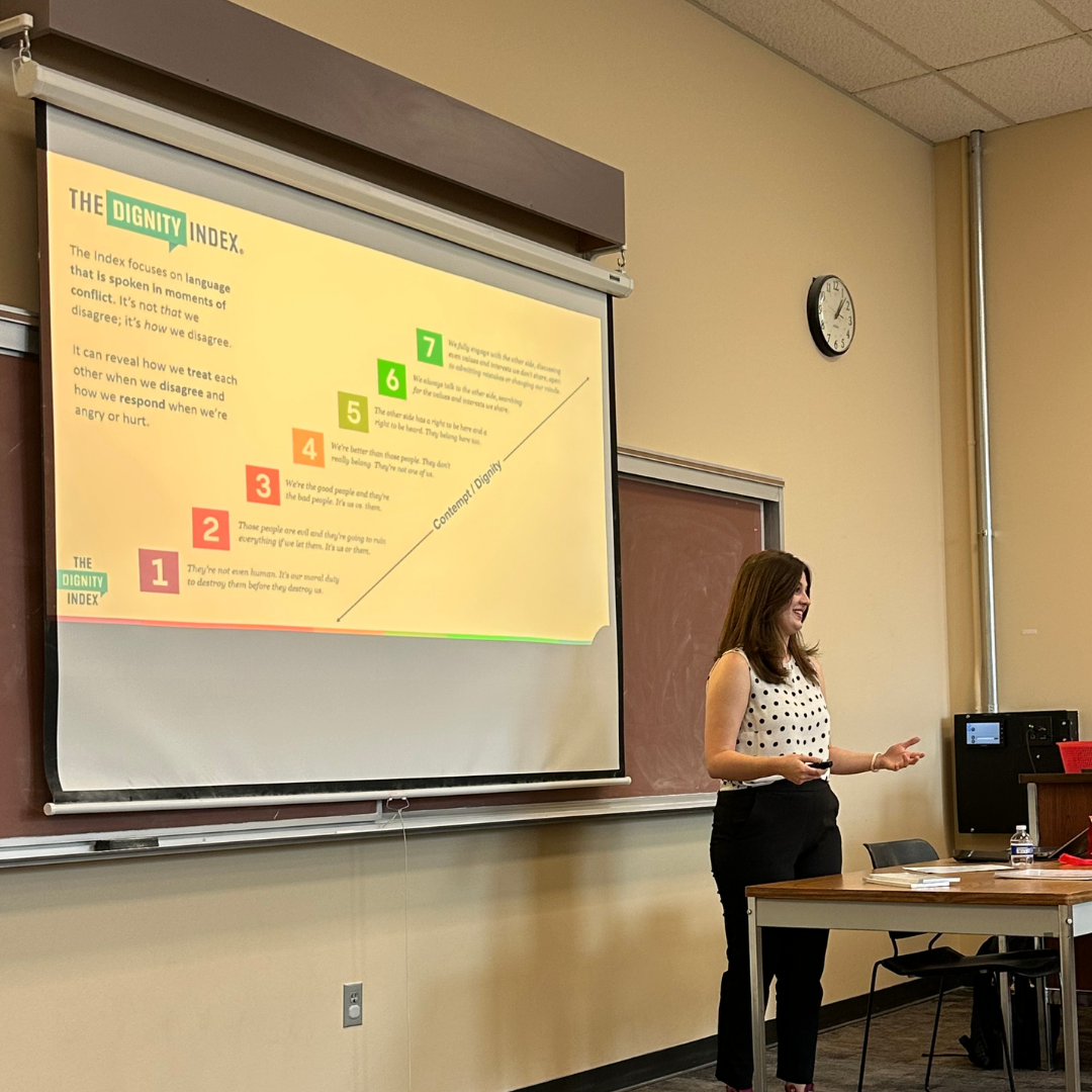 Madeleine giving a presentation on the Dignity Index