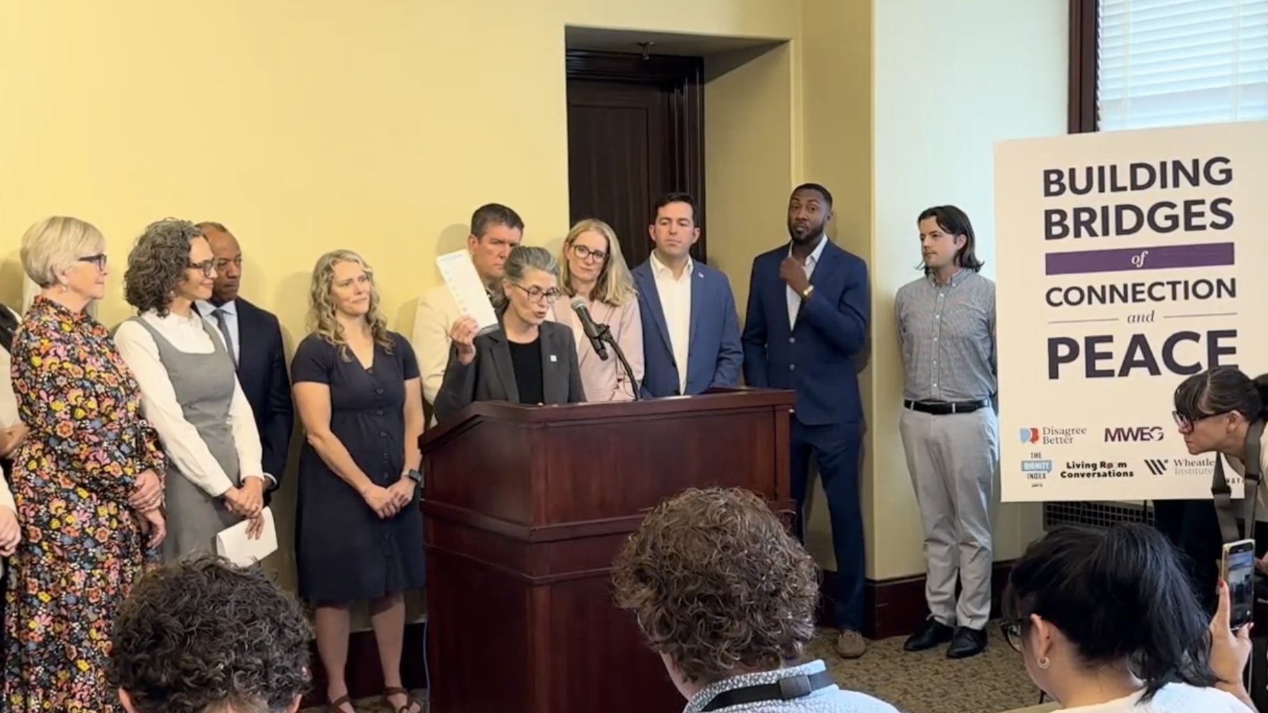 Tami Pyfer speaking from a podium