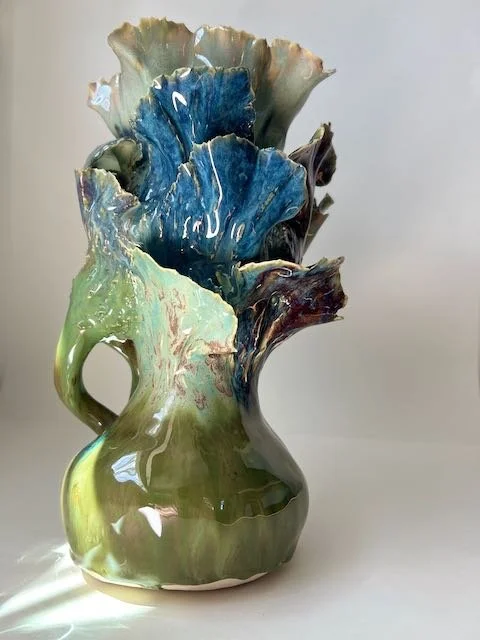 Hand Built, B-Mix clay, Six glazes. 
Fired to Cone 6 in community kiln. 
Dimensions: 11.5" x 6"