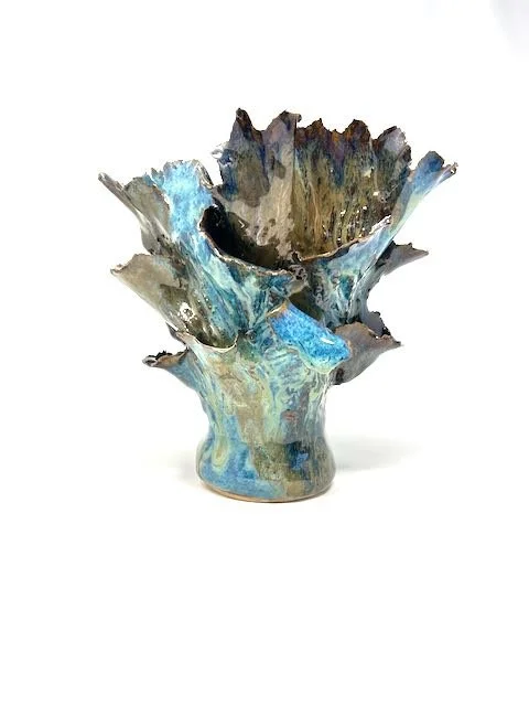 Hand Built, Speckled Buff clay, Four glazes. Fired to Cone 5 in home kiln.  
Dimensions: 9" x 6.5"