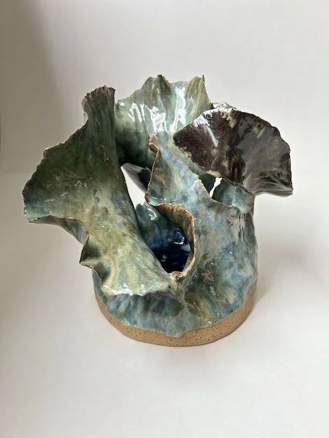 Hand Built, Speckled Buff clay, Five glazes. Fired to Cone 5 in community kiln. 
Dimensions: 11" x 10.5"