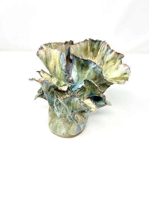 Hand Built, Speckled Buff clay, Six glazes. Fired to Cone 5 in home kiln. 