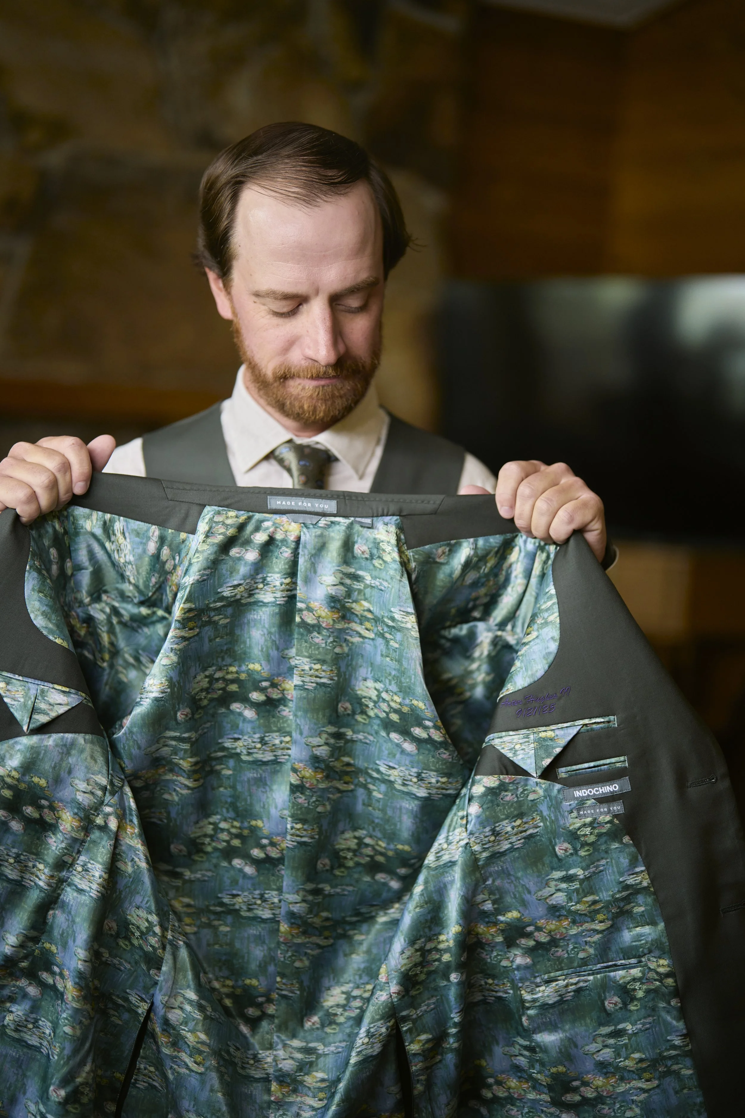 Groom showing off his custom suit prior to his wedding at Sundance Resort.