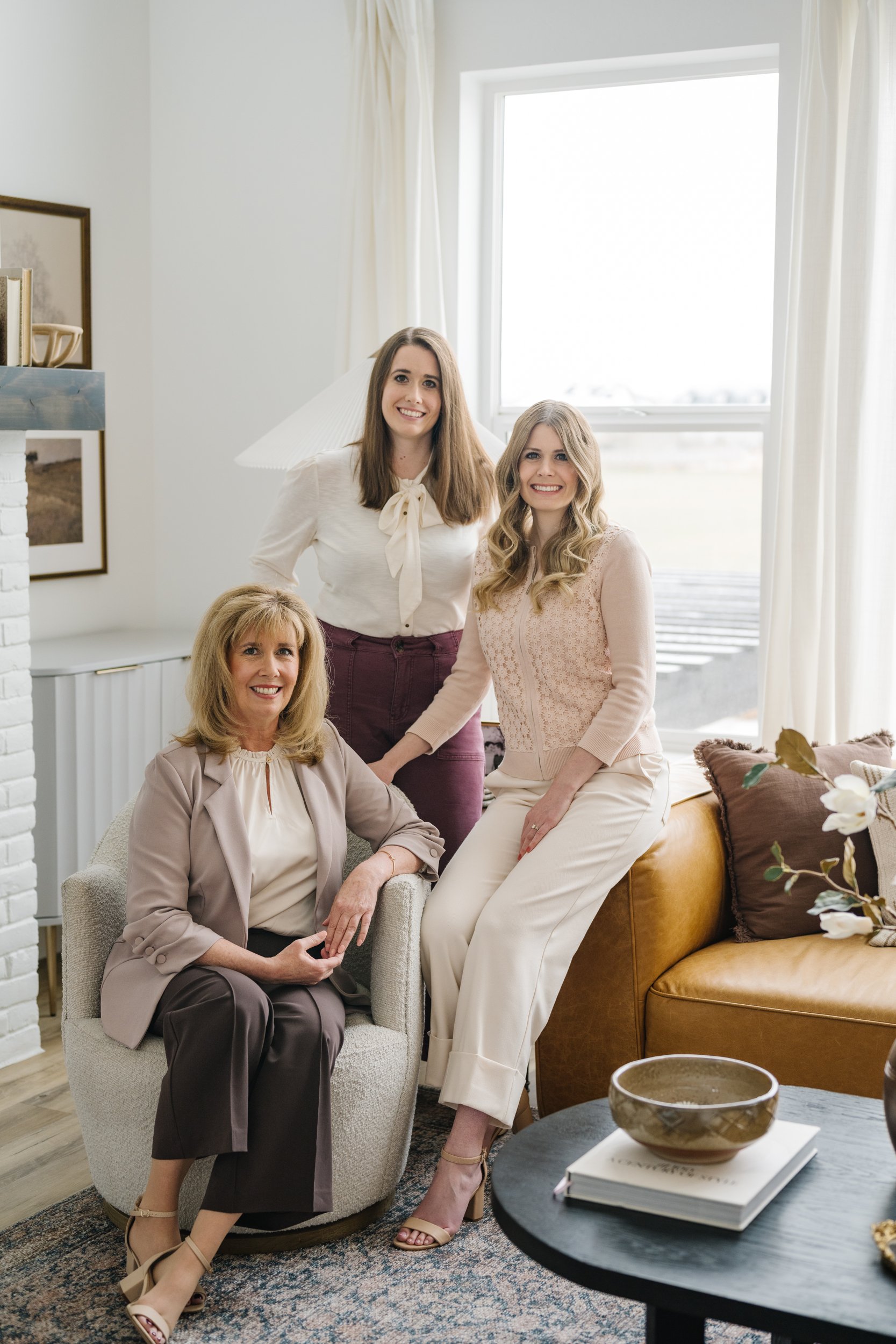 Heirloom Weddings & Events Founder, Marla, with wedding planning team members Courtney and Amanda in a luxury studio.