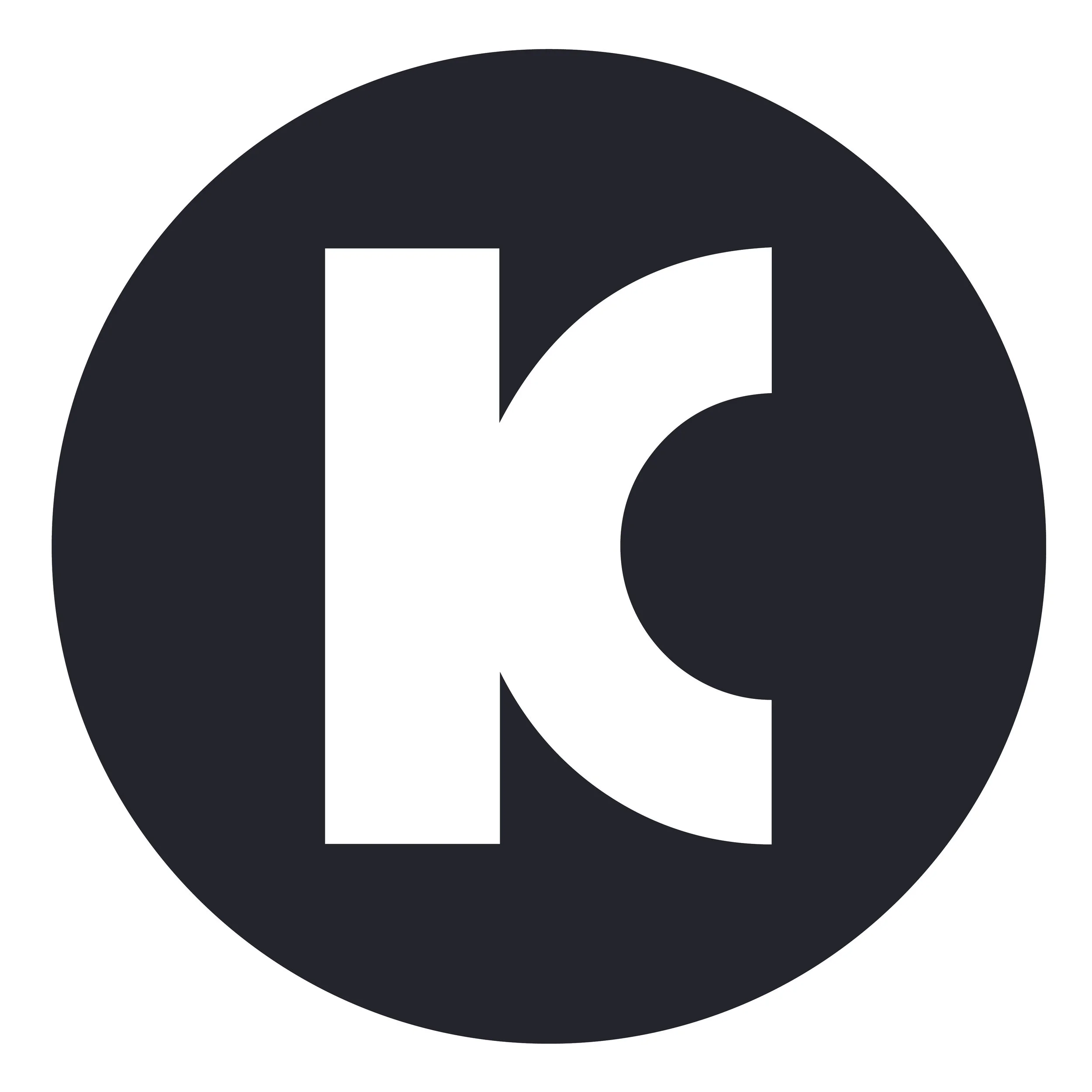 Black circle with white letter 'K' inside