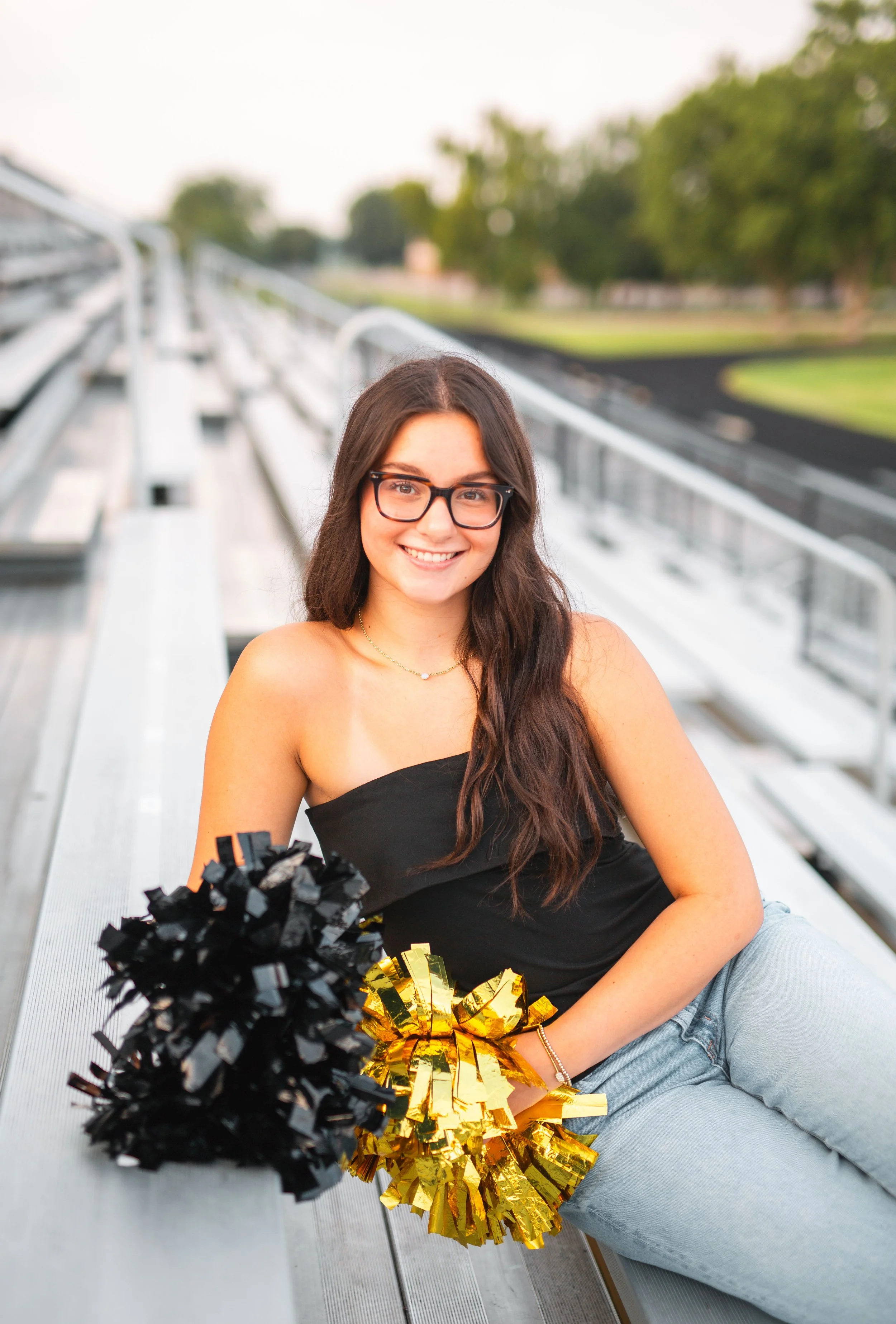 Sycamore HS Pom Dance Senior Portrait in Football Stadium Stands