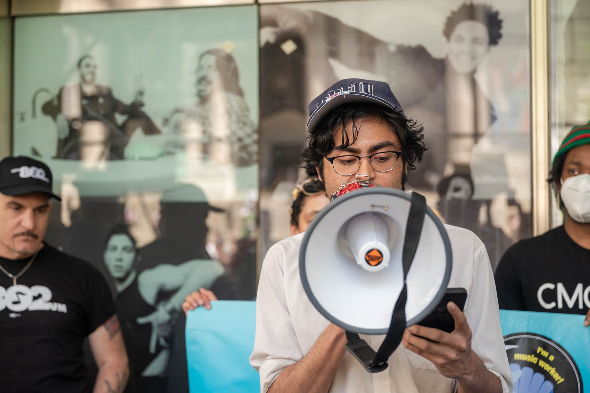 Sanjeev of Secretly Group Union speaks during the Fair Pay at SXSW Rally
