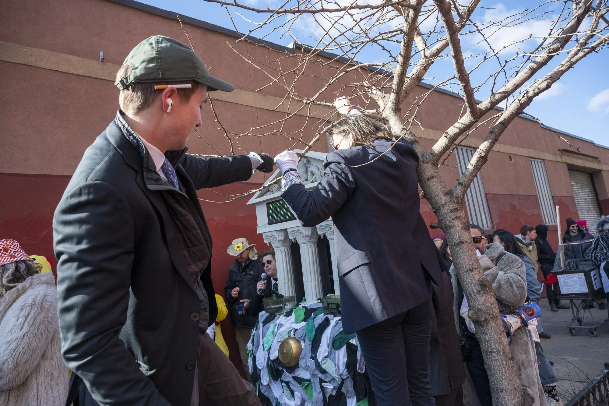 Members of New York Sock Exchange protecting tree branches from their cart