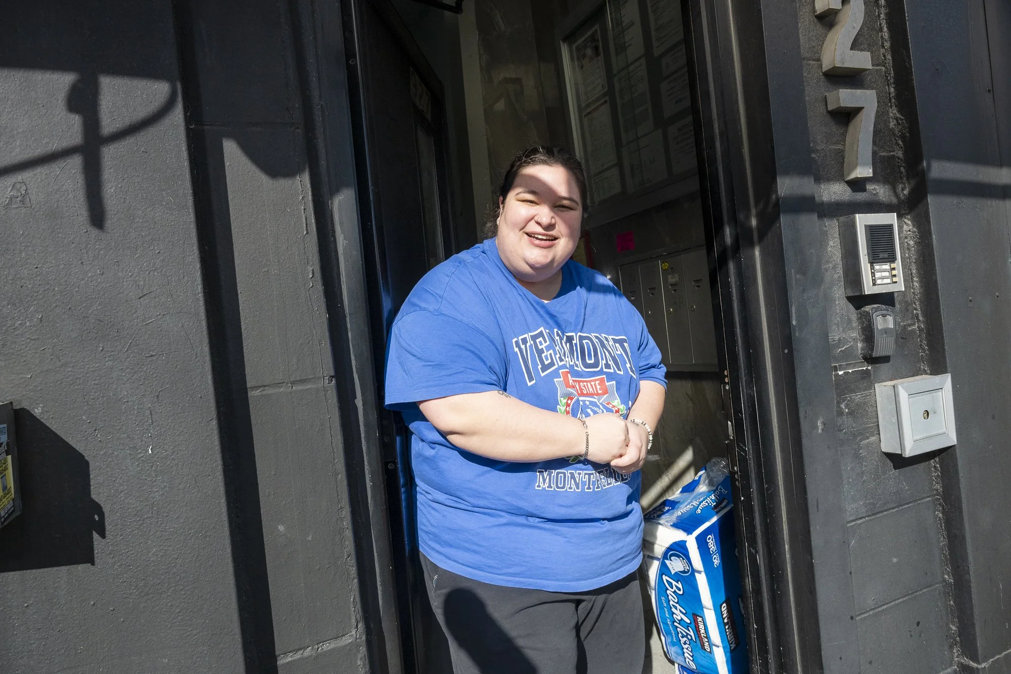 A person watches Idiotarod teams heading to the first checkpoint on Grand Street