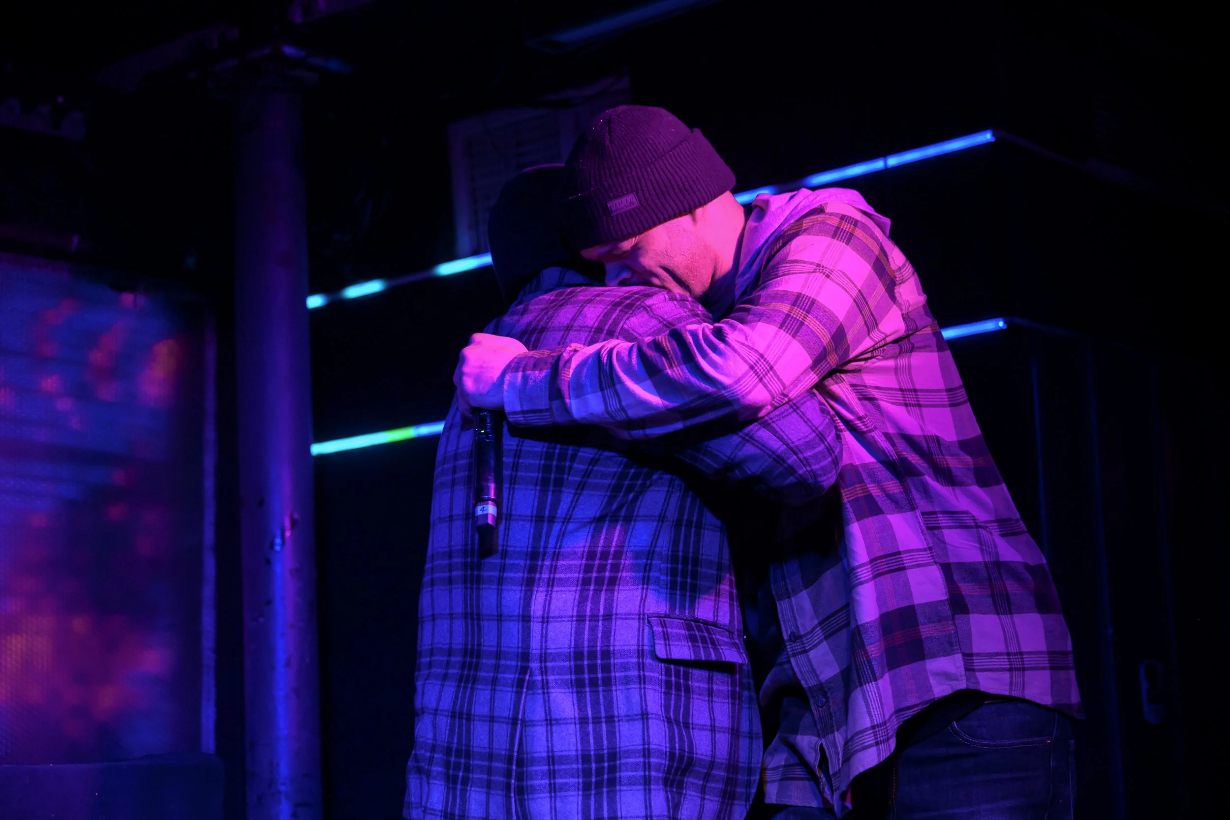 Vordul Mega and Alaska hug at Zone One at Elsewhere