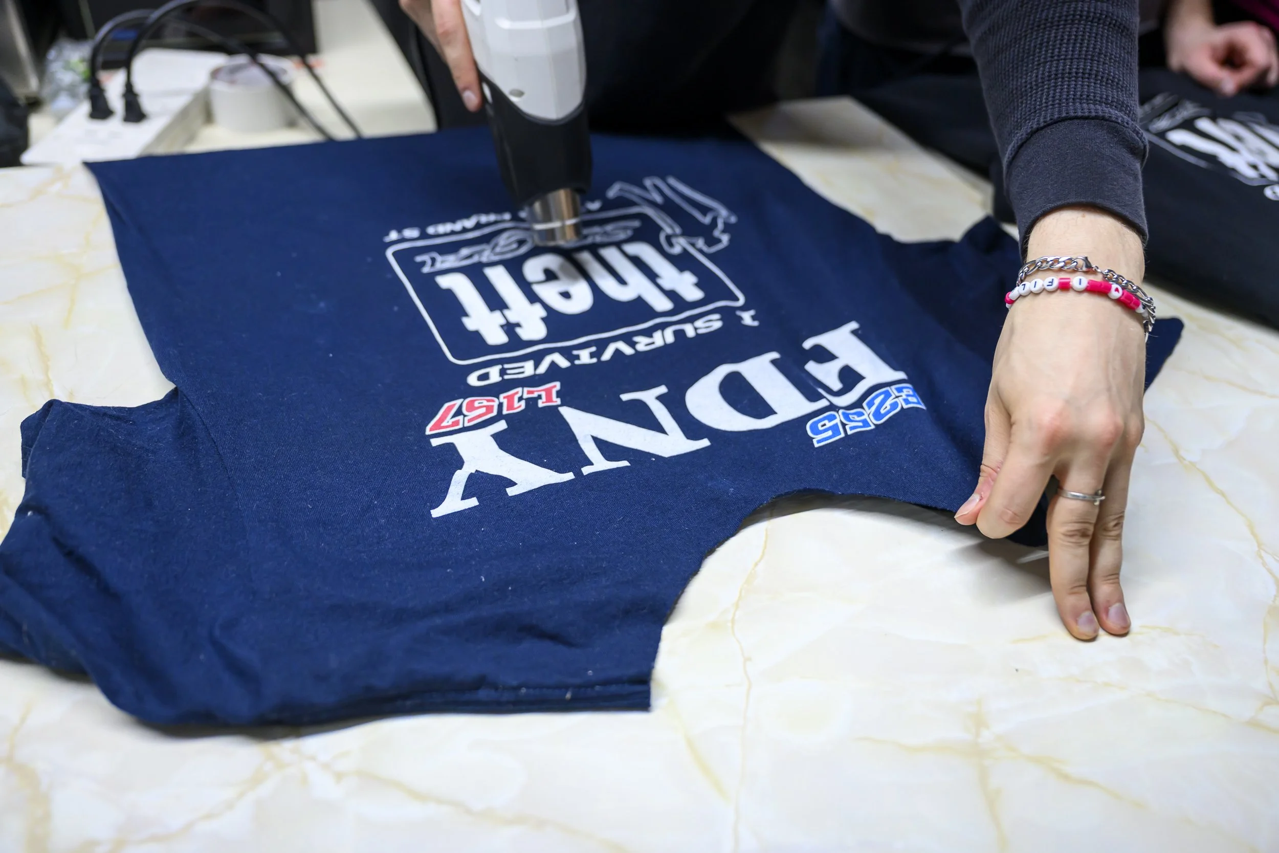 A fan brought an FDNY shirt for screenprinting