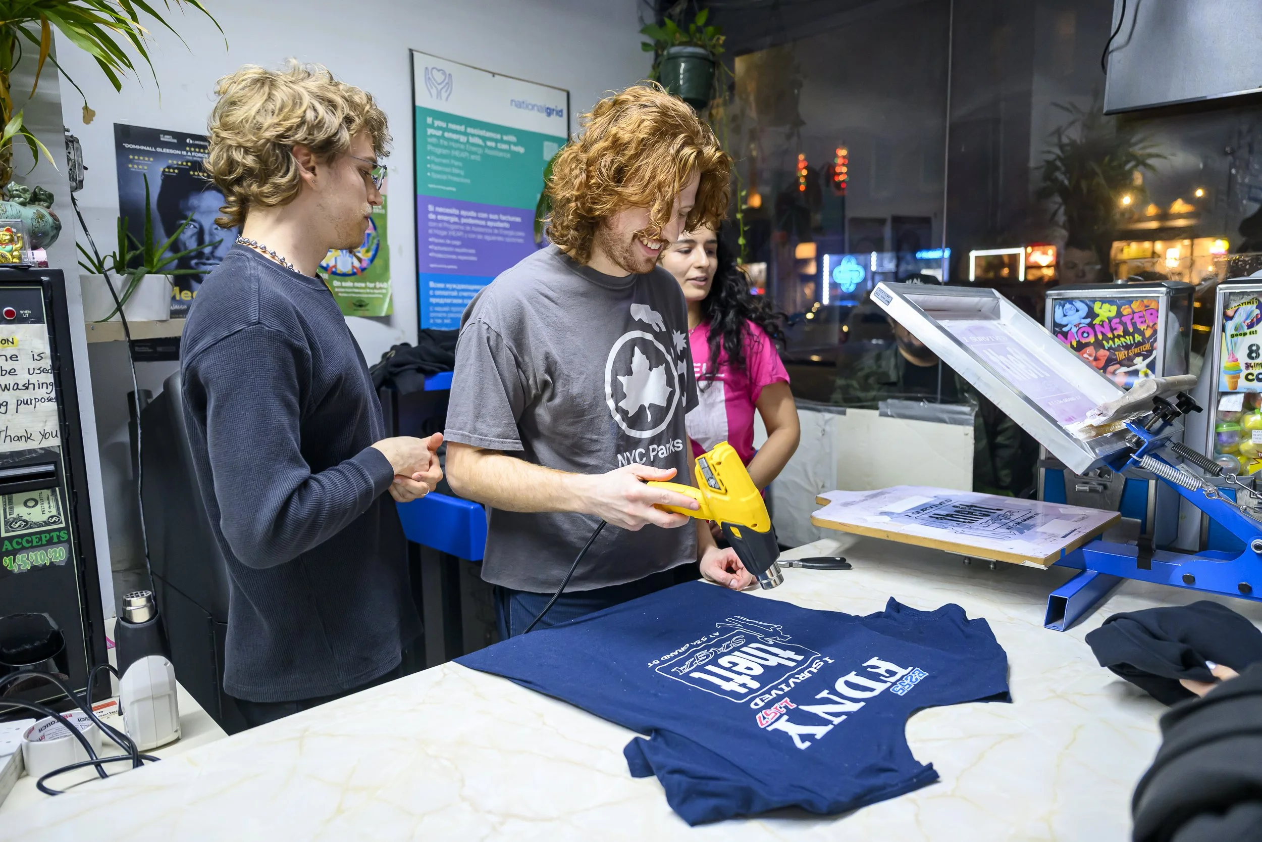 Lip Critic's Bret Kaser (left) at the screenprinting station before their performance