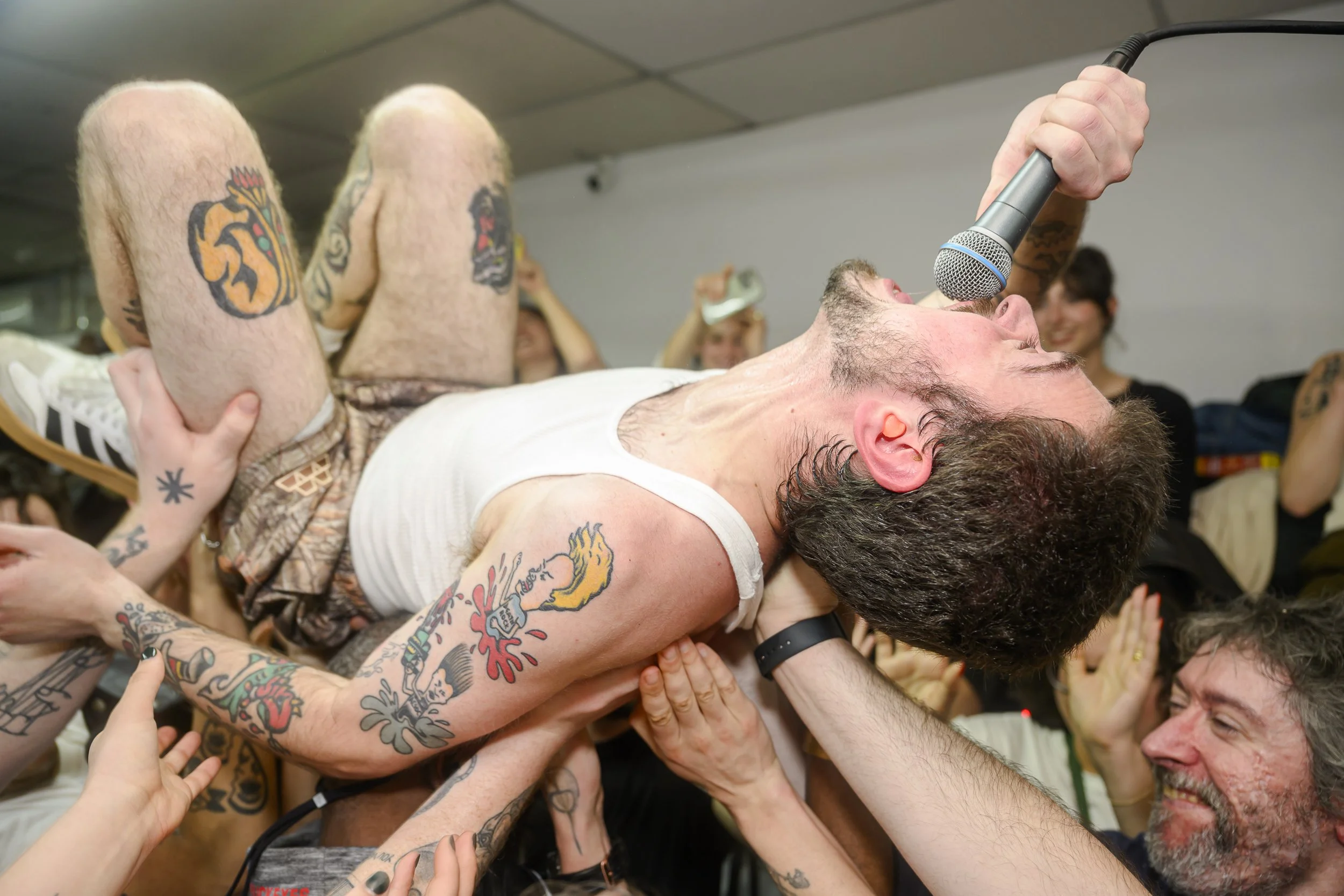 Danny of Lip Critic crowdsurfs during "Milky Max" at Yong Xin Tan Laundromat