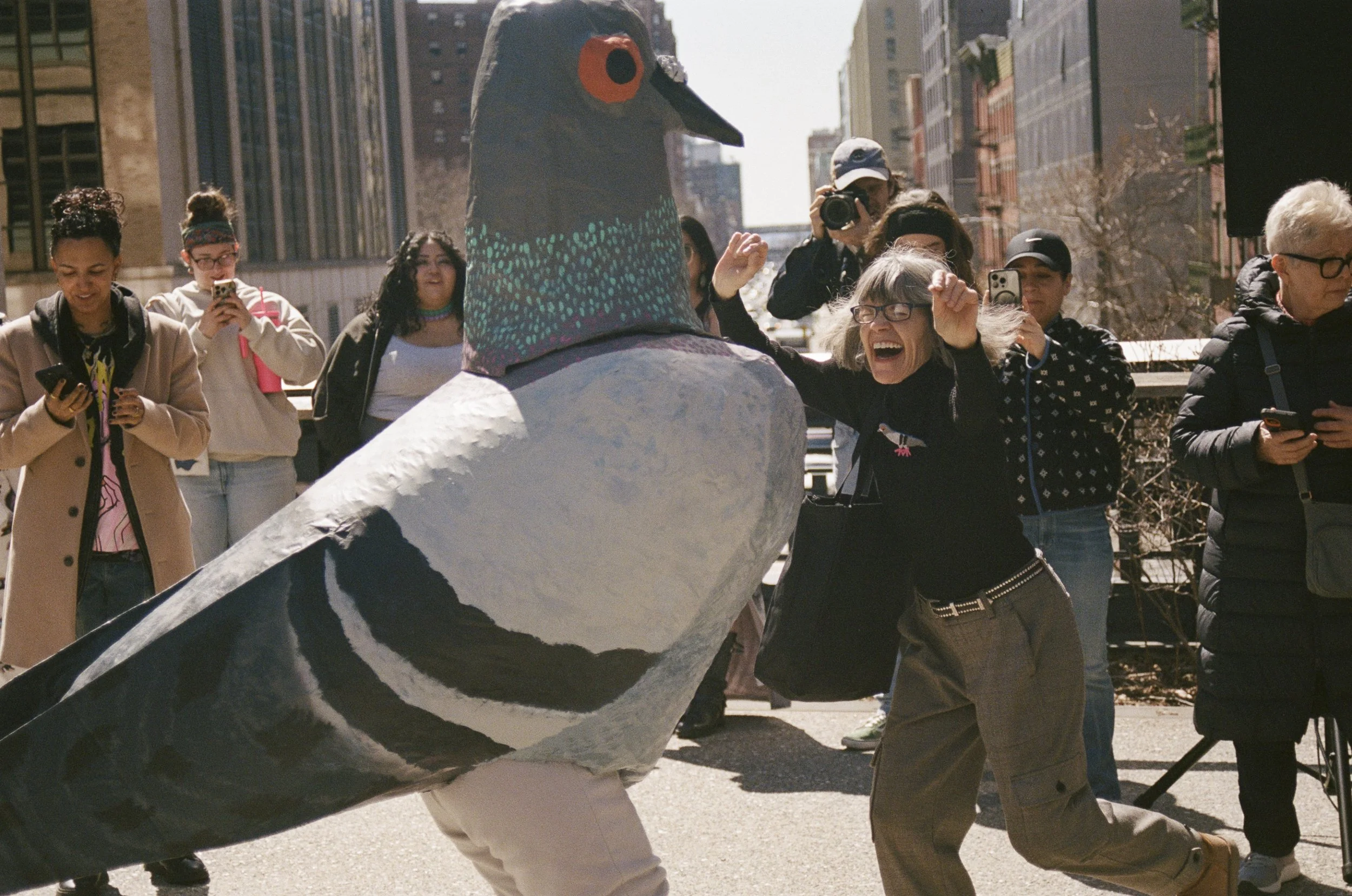 Pigeon (Miriam Abrahams) dances with an attendee during a DJ set