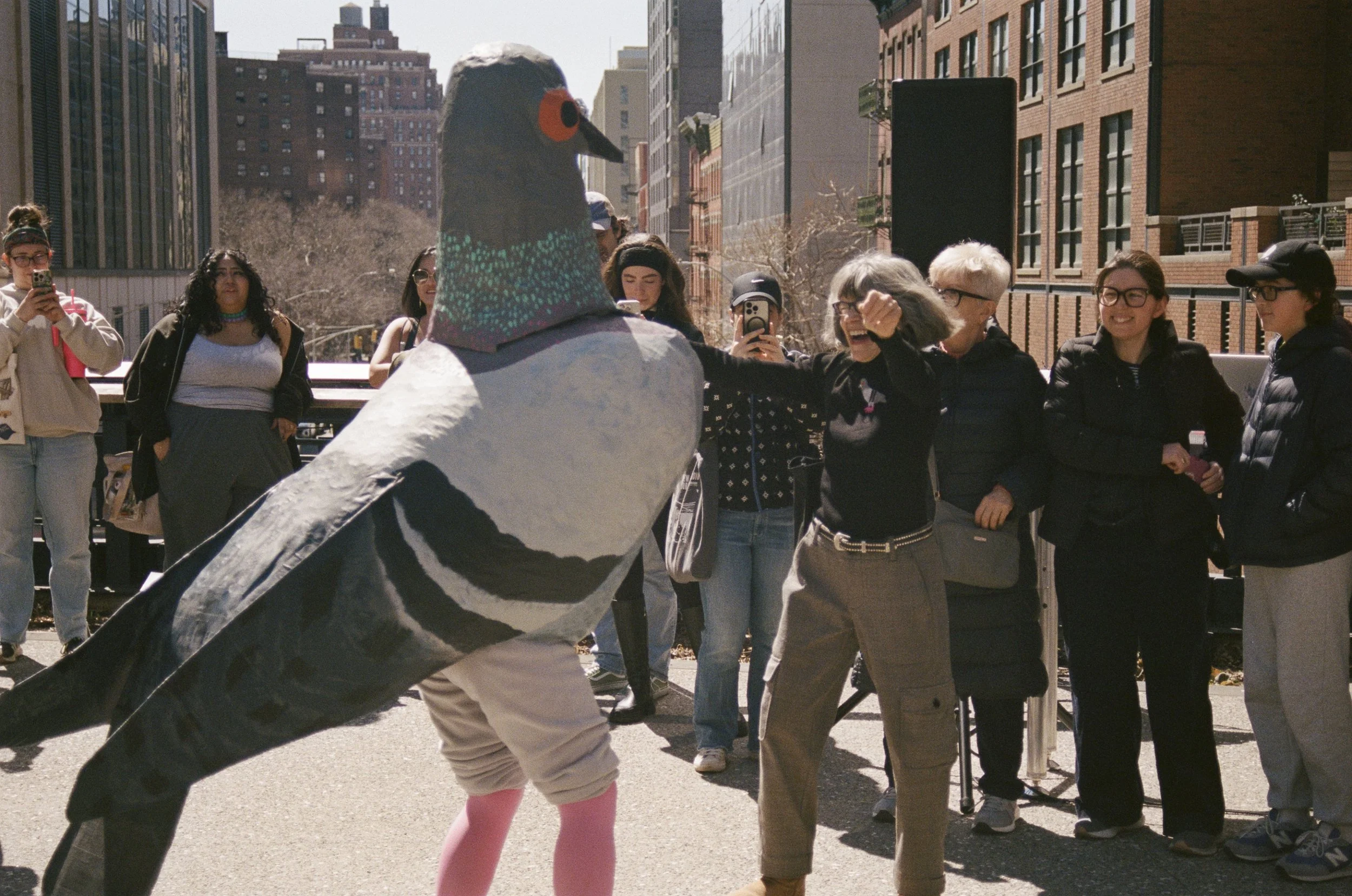 Pigeon (Miriam Abrahams) dances with an attendee during a DJ set