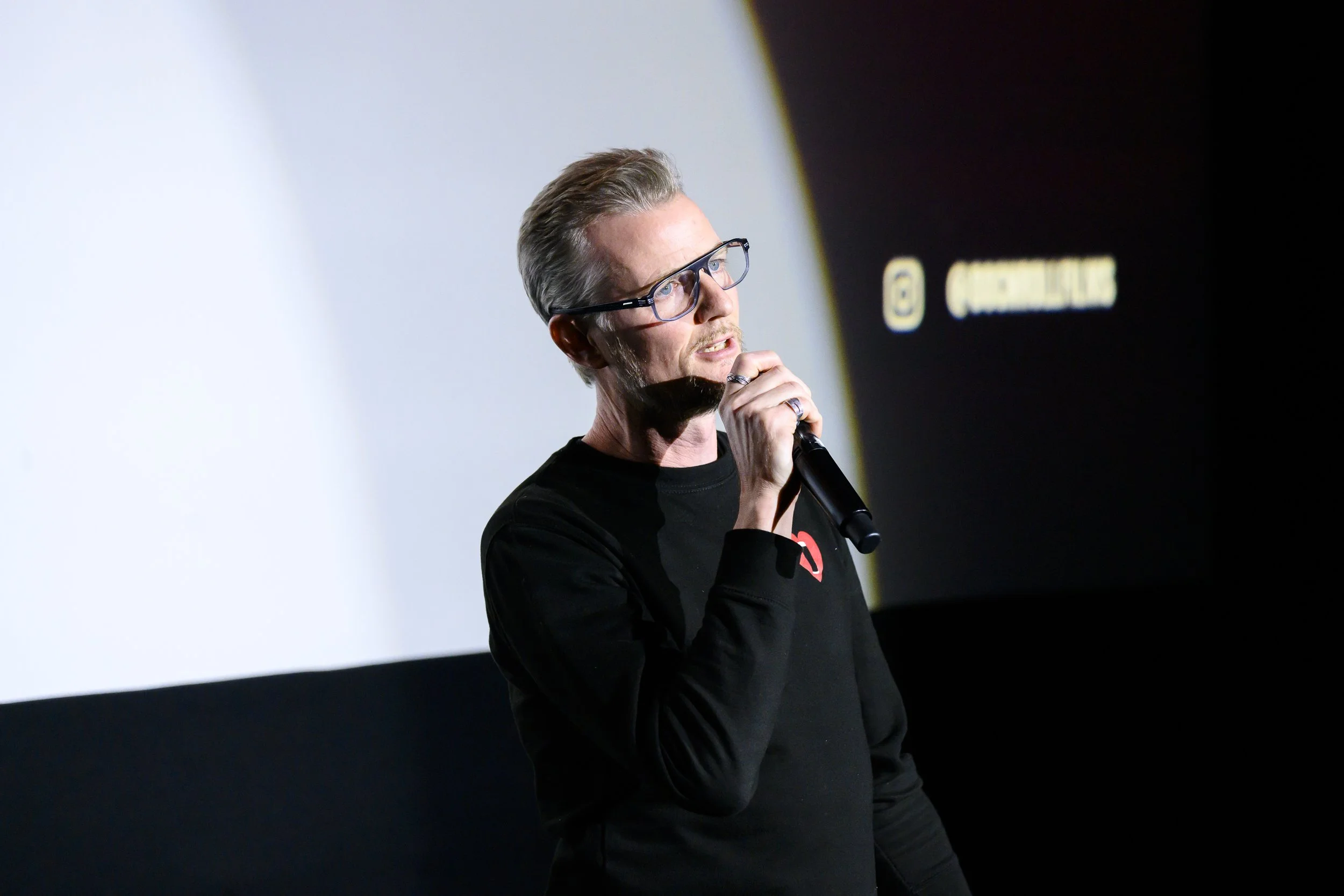Colm Forde of Doc'n Roll addresses the audience before a screening of Butthole Surfers: The Hole Truth and Nothing Butt