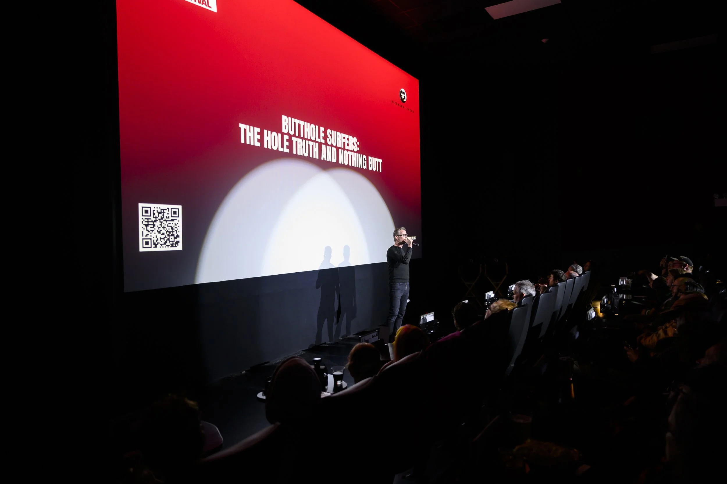 Colm Forde of Doc'n Roll addresses the audience before a screening of "Butthole Surfers: The Hole Truth and Nothing Butt"