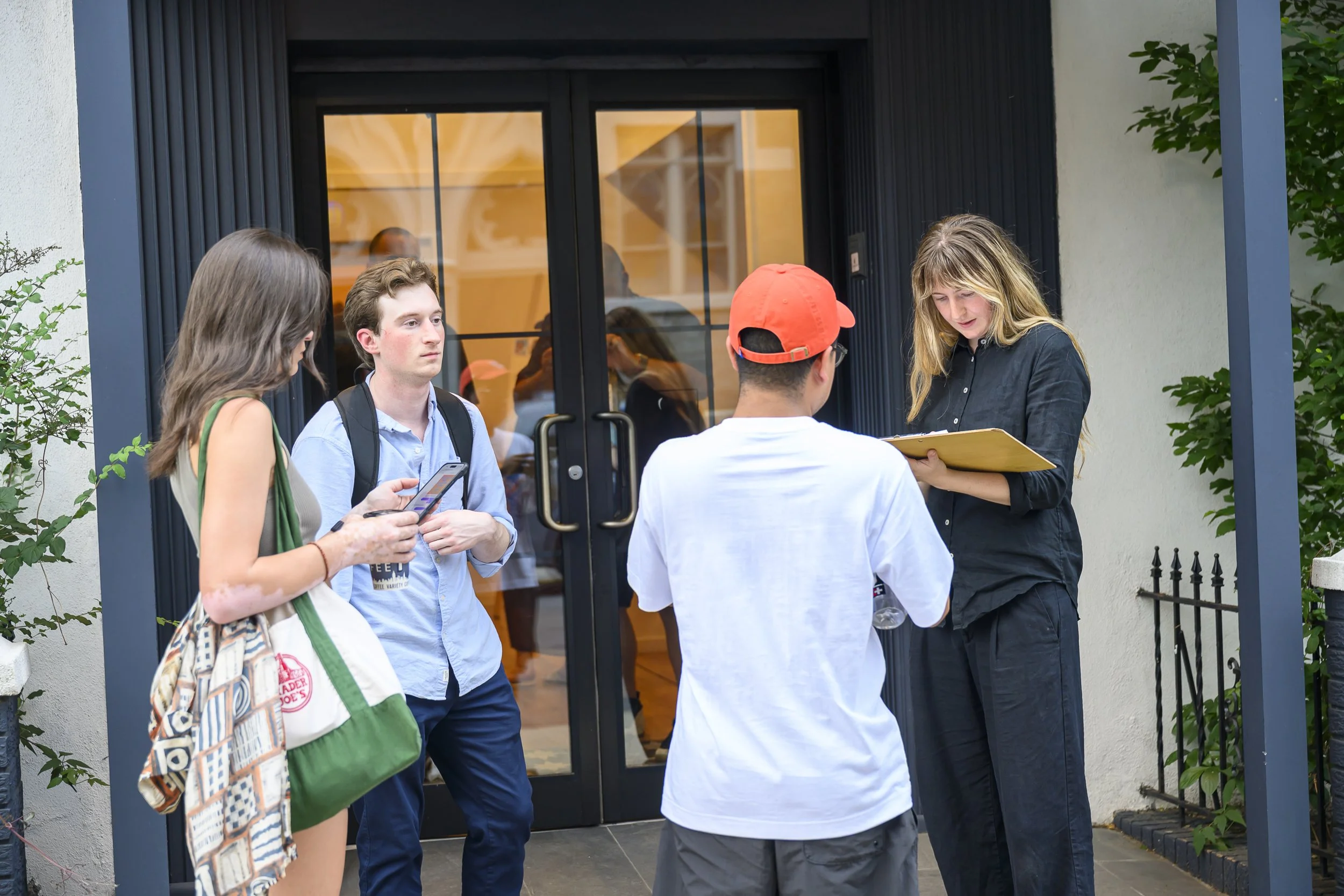 Attendees check in to Sparrow to attend the watch party