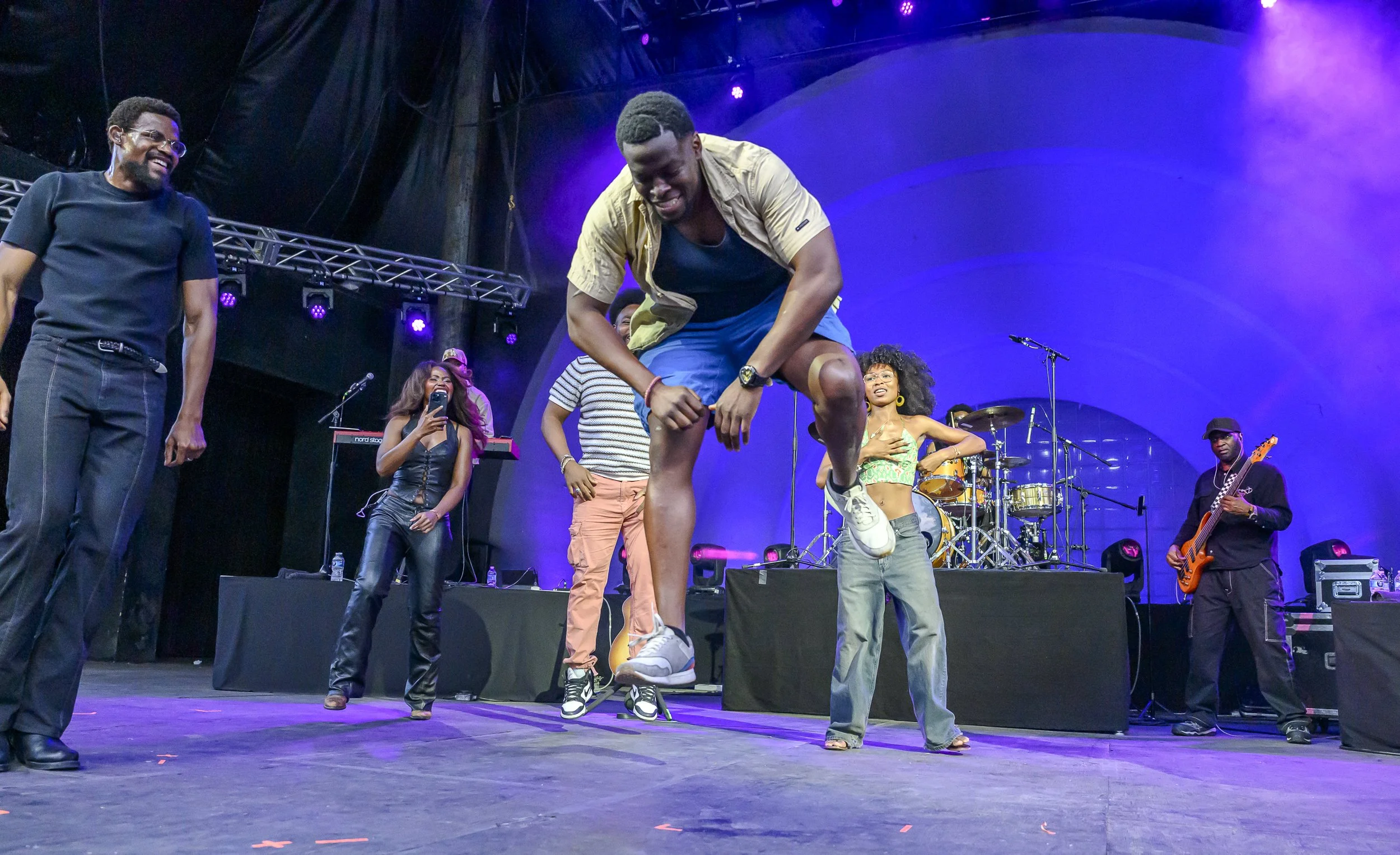 An audience member dances on stage during Infinity Song's set at BRIC Celebrate Brooklyn! on Friday, June 19, 2026.