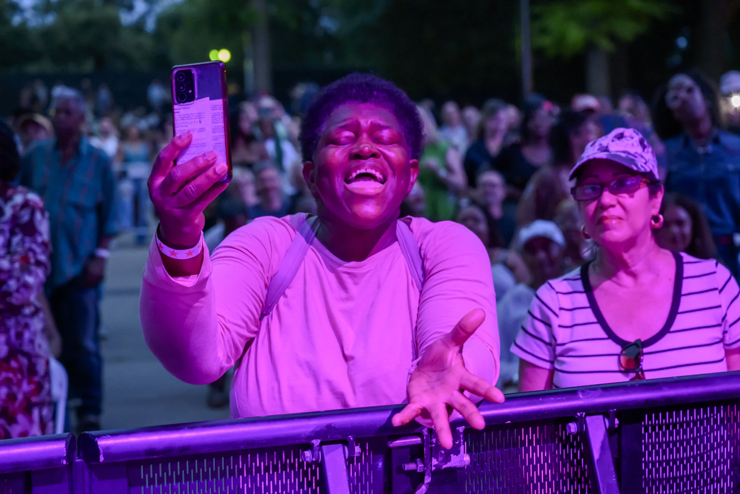A fan sings along with Patti LaBelle at BRIC Celebrate Brooklyn!