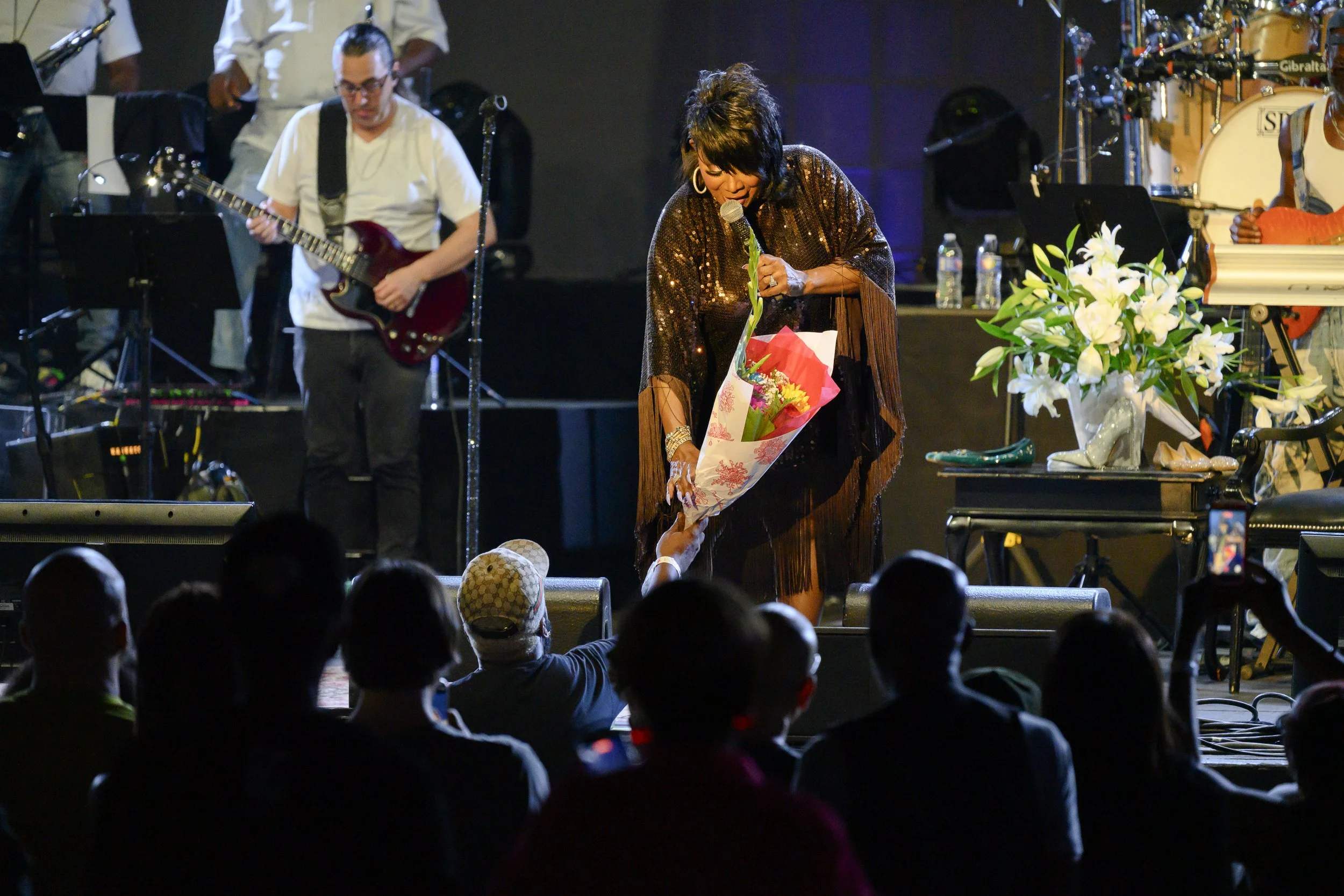 A fan gives Patti LaBelle flowers during her performance at BRIC Celebrate Brooklyn!