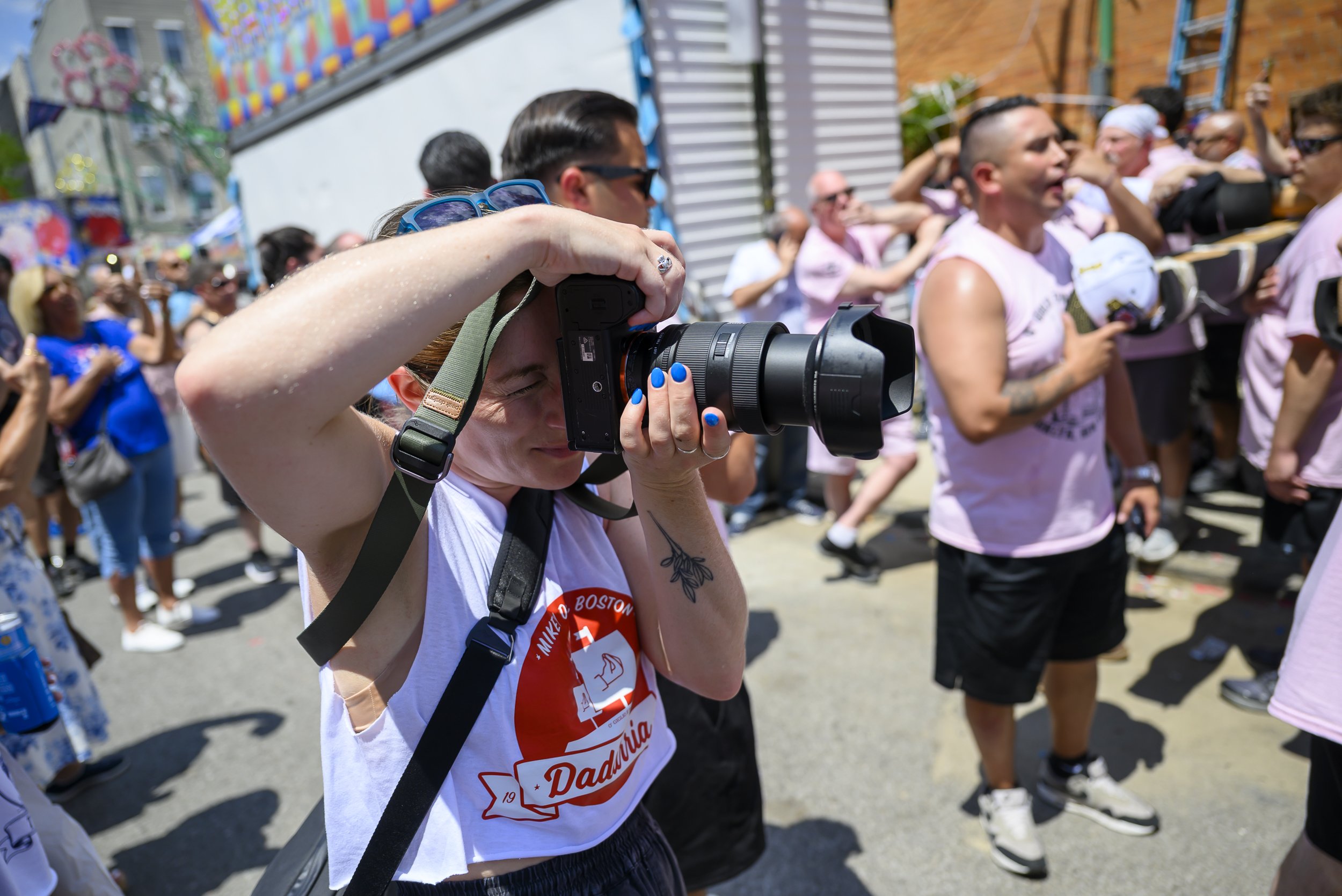 Photographer Katie Dadarria captures her father about to lift the boat on Giglio Sunday