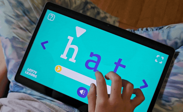 Phonics Factory from Lotty Learns showing a child decoding words through explicit phonics practice without pictures or guessing
