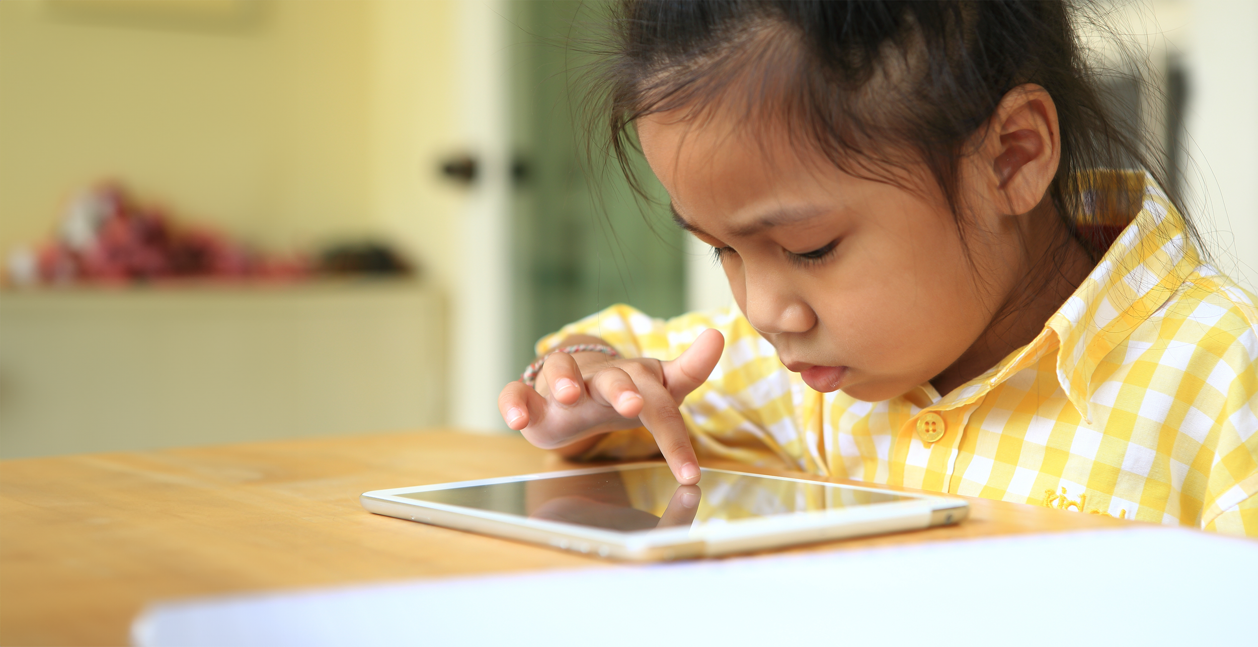 Young child using the Lotty Learns Phonics Factory to learn to read real words
