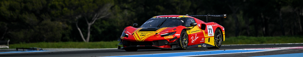 A race car on a track during daytime, painted in red and yellow with sponsor logos, number 71.