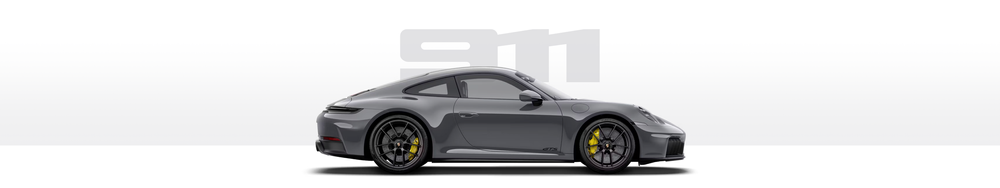 Gray Porsche sports car with black wheels and yellow brake calipers.