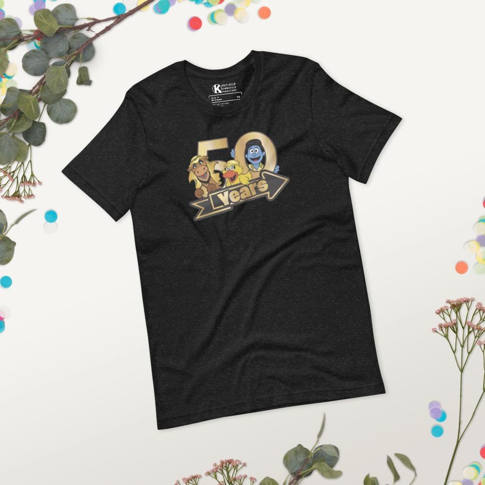 You can celebrate 50 years of One Way by sporting our new 50 Years Tee! 😃

This soft and lightweight t-shirt features some of your favorite One Way characters in their gold, 50th attire. 

Available exclusively through Project HQ. Just follow the li