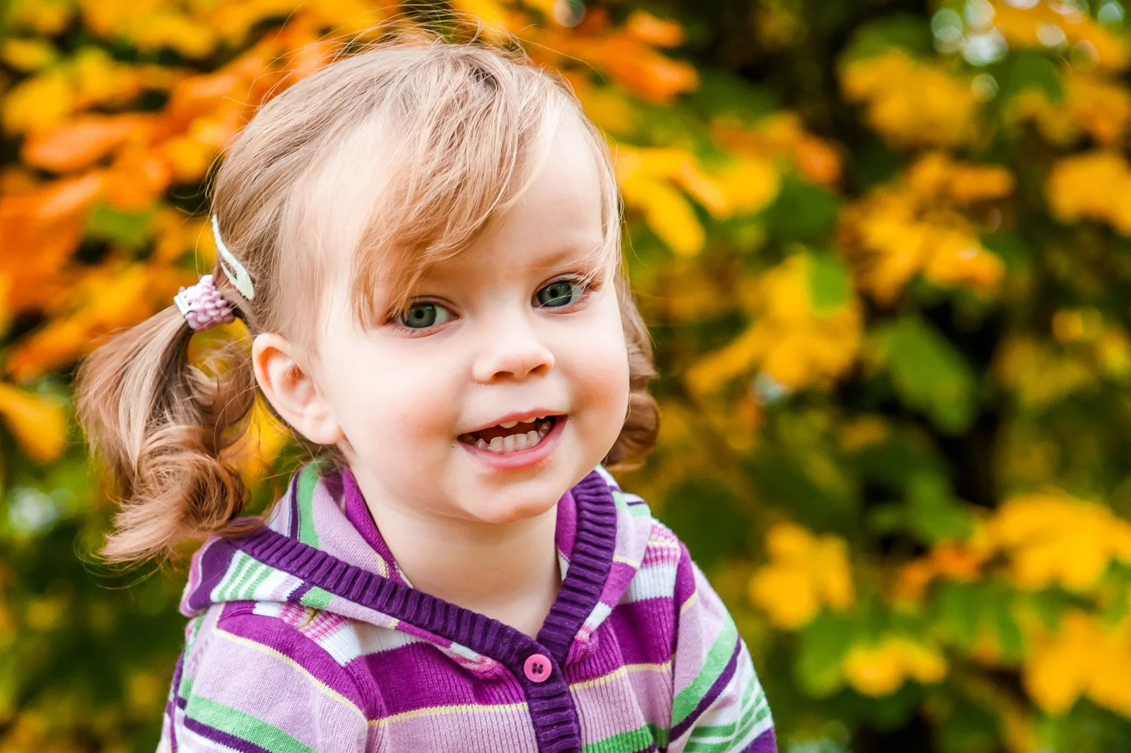 Family photography session at Cameron House Hotel with a young girl during autumn