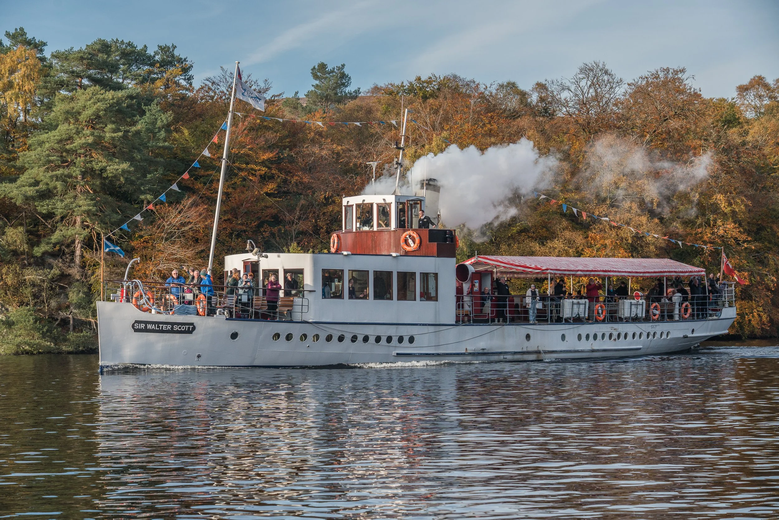 Autumn scenic picture of Steamship Sir Walter Scott sailing on Loch Katrine