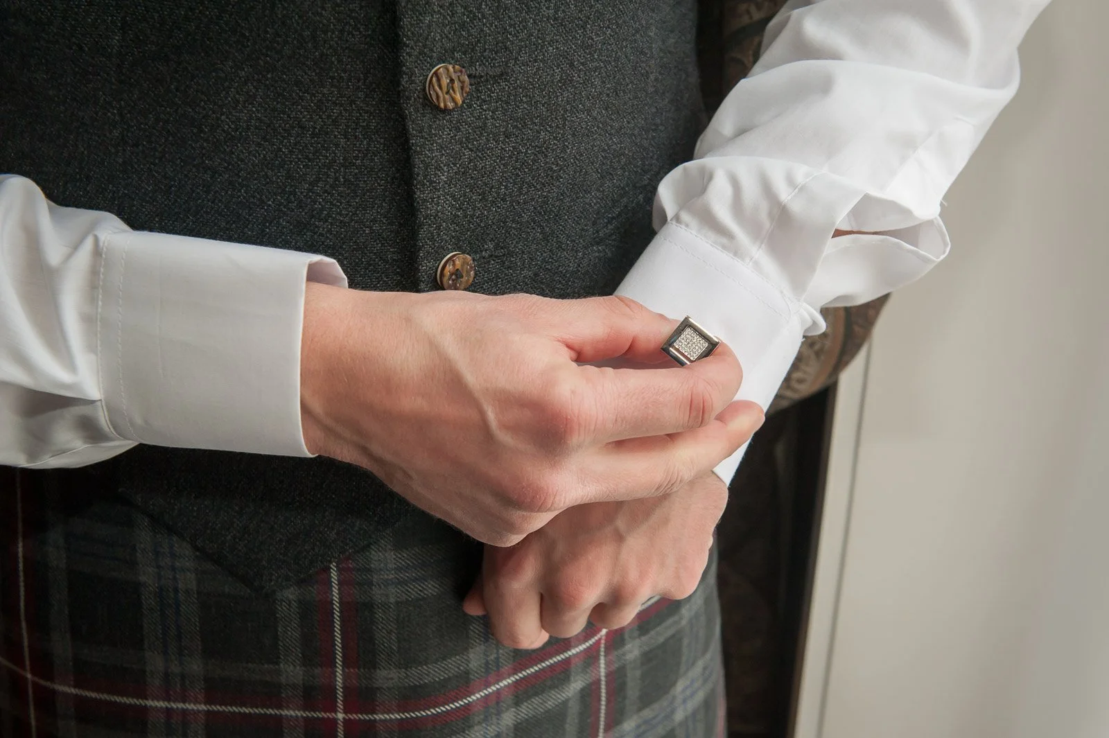 Wedding photograph of groom with cufflinks at Loch Lomond's Cameron House Hotel