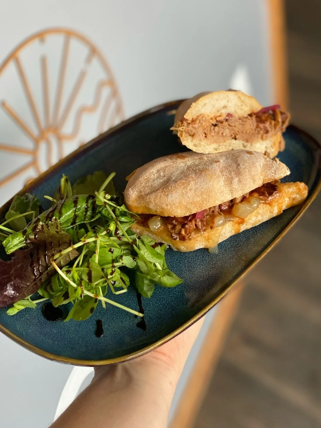 Heated panini with side salad
