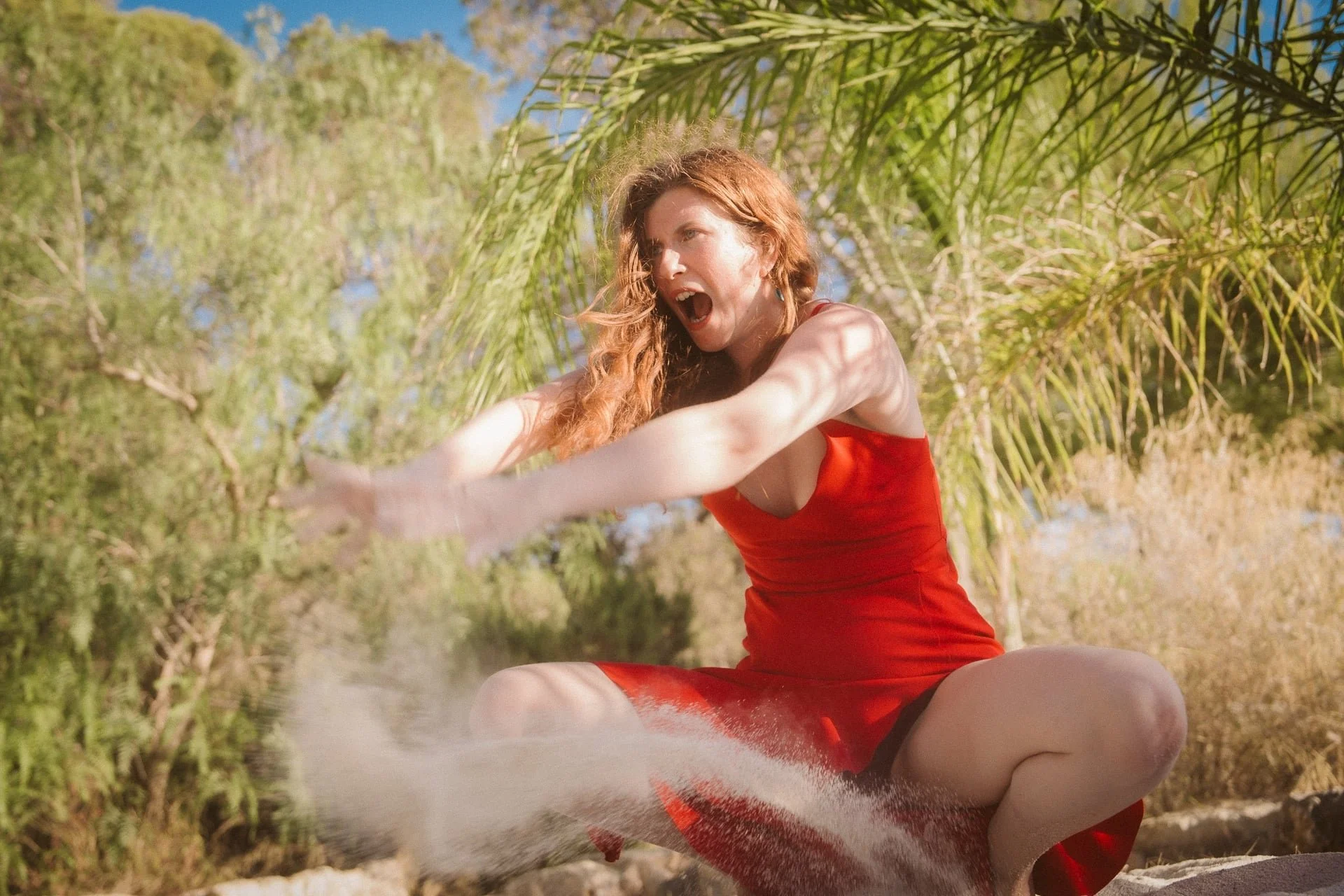 Woman expressing anger and dark goddess energy during transformational journey with coach and guide, Aoise