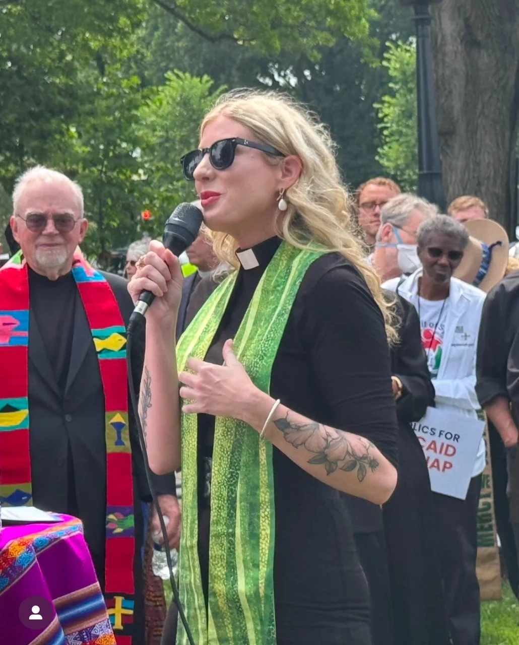 Executive Director, Rev. Dr. Shannon Fleck speaking with other clergy