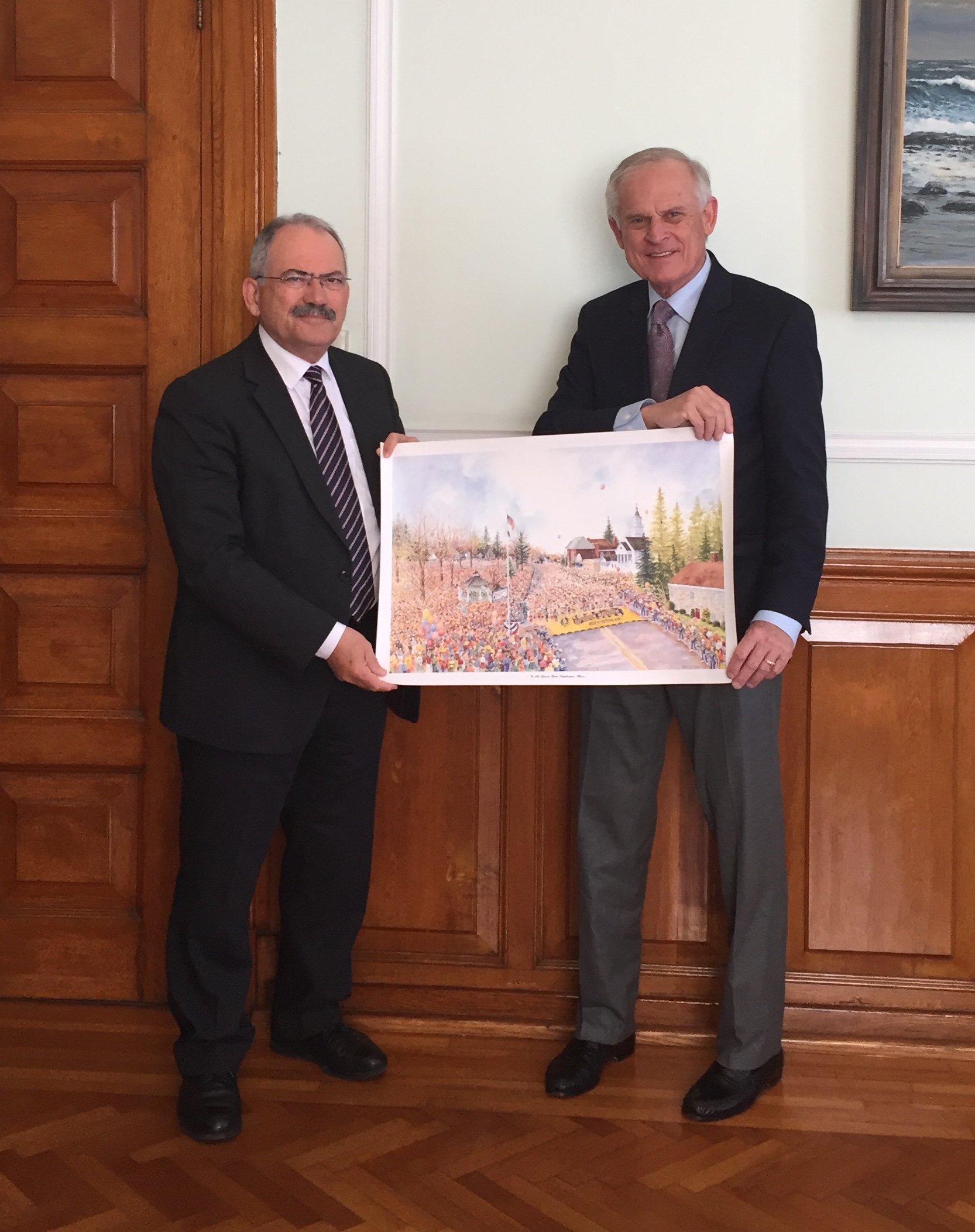 Tim Kilduff being awarded a painting of the Limassol Marathon