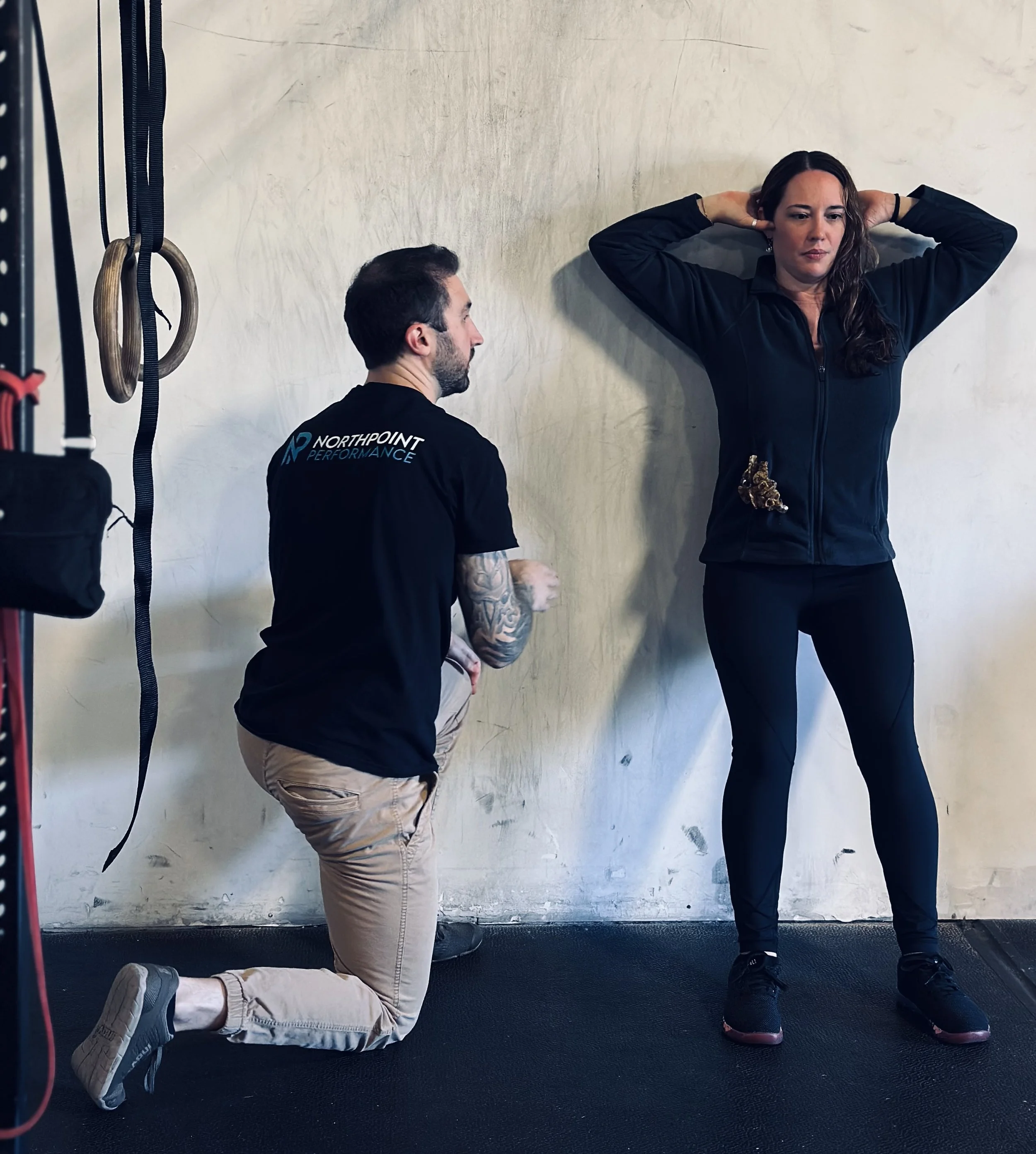 A magnifying glass with a black handle placed on a blue surface.