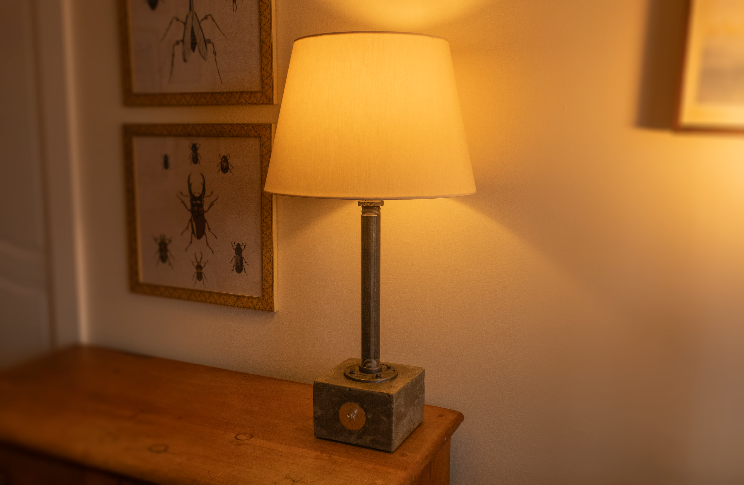 Concrete cube with heavy-throw on/off toggle