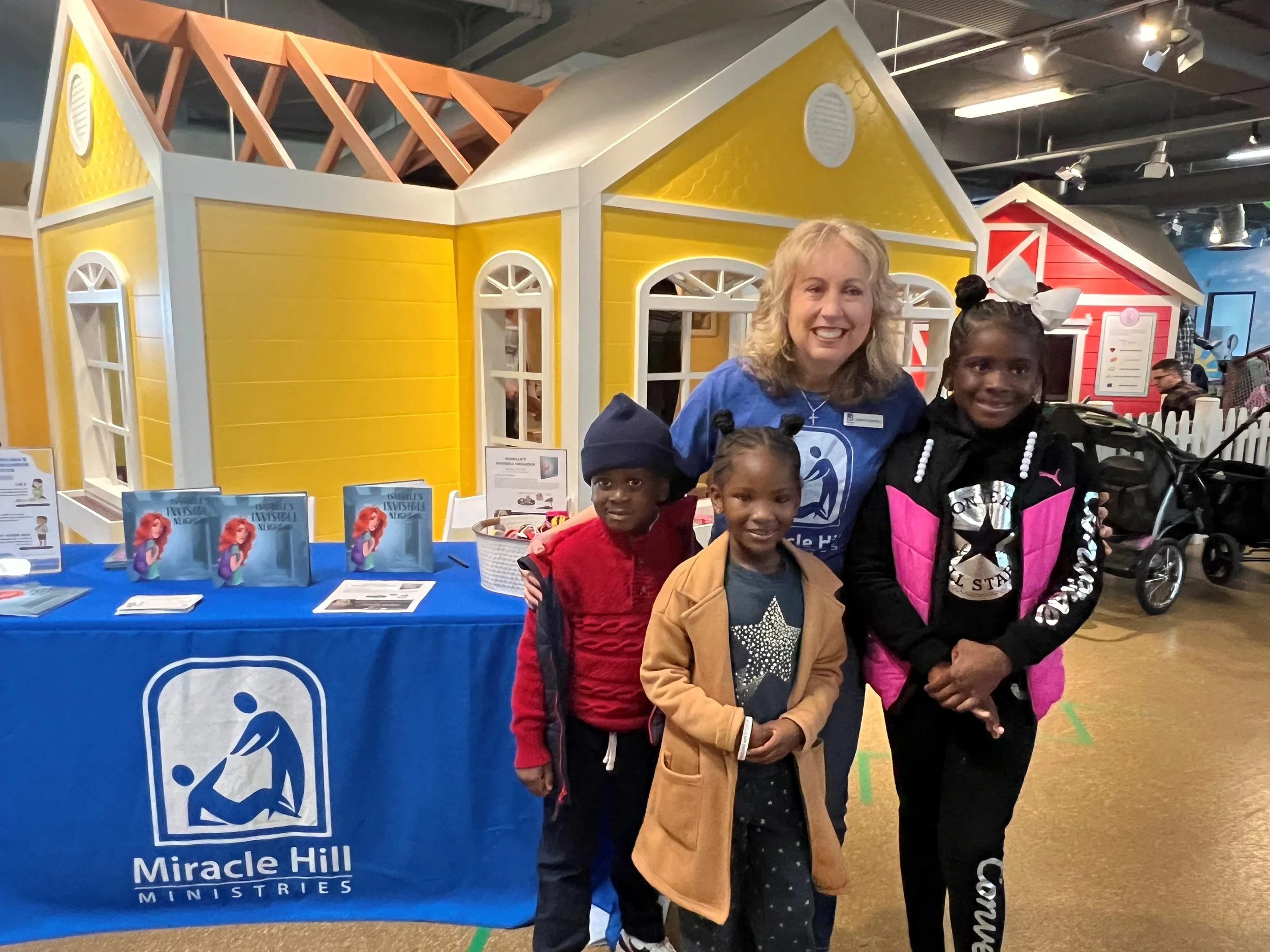 Sandy Furnell with children at The Children's Museum of the Upstate