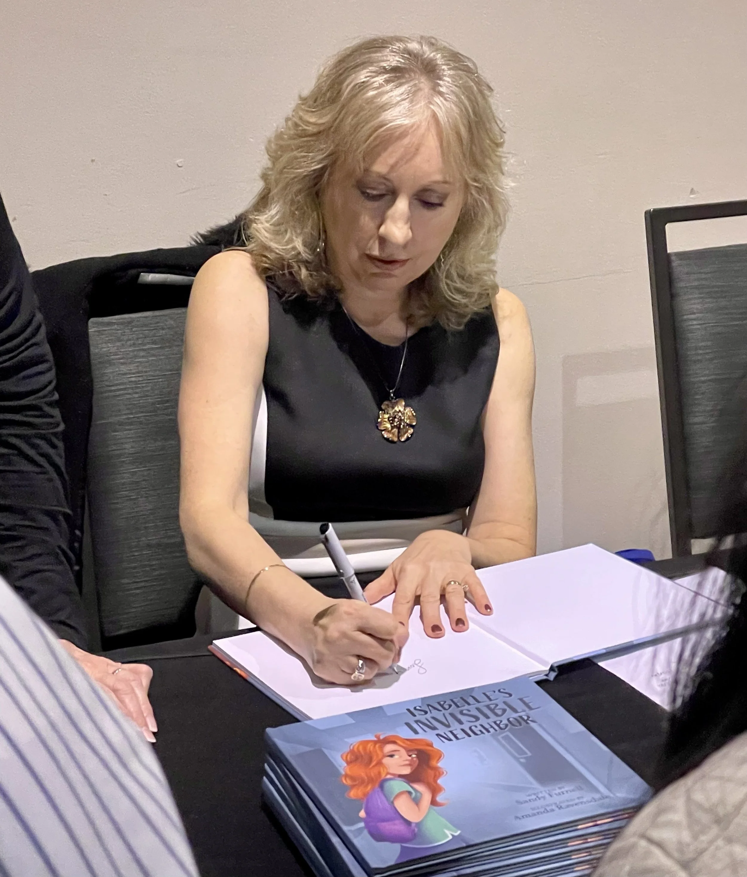Sandy Furnell signing Isabelle's Invisible Neighbor books