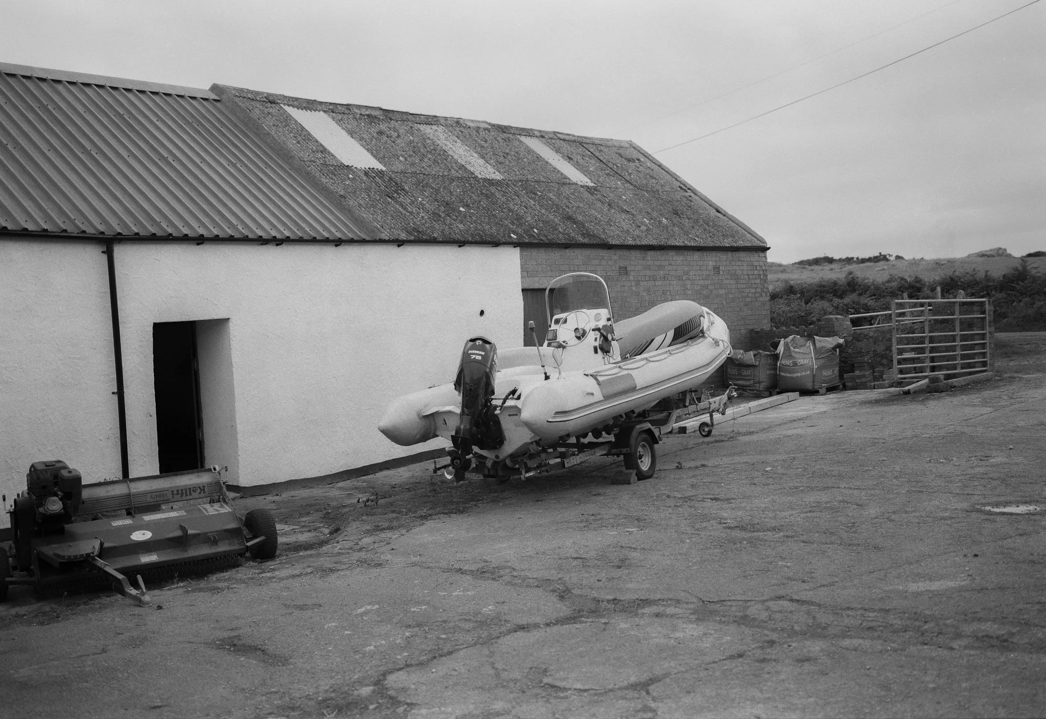 Speedboat by Barn, Anglesey