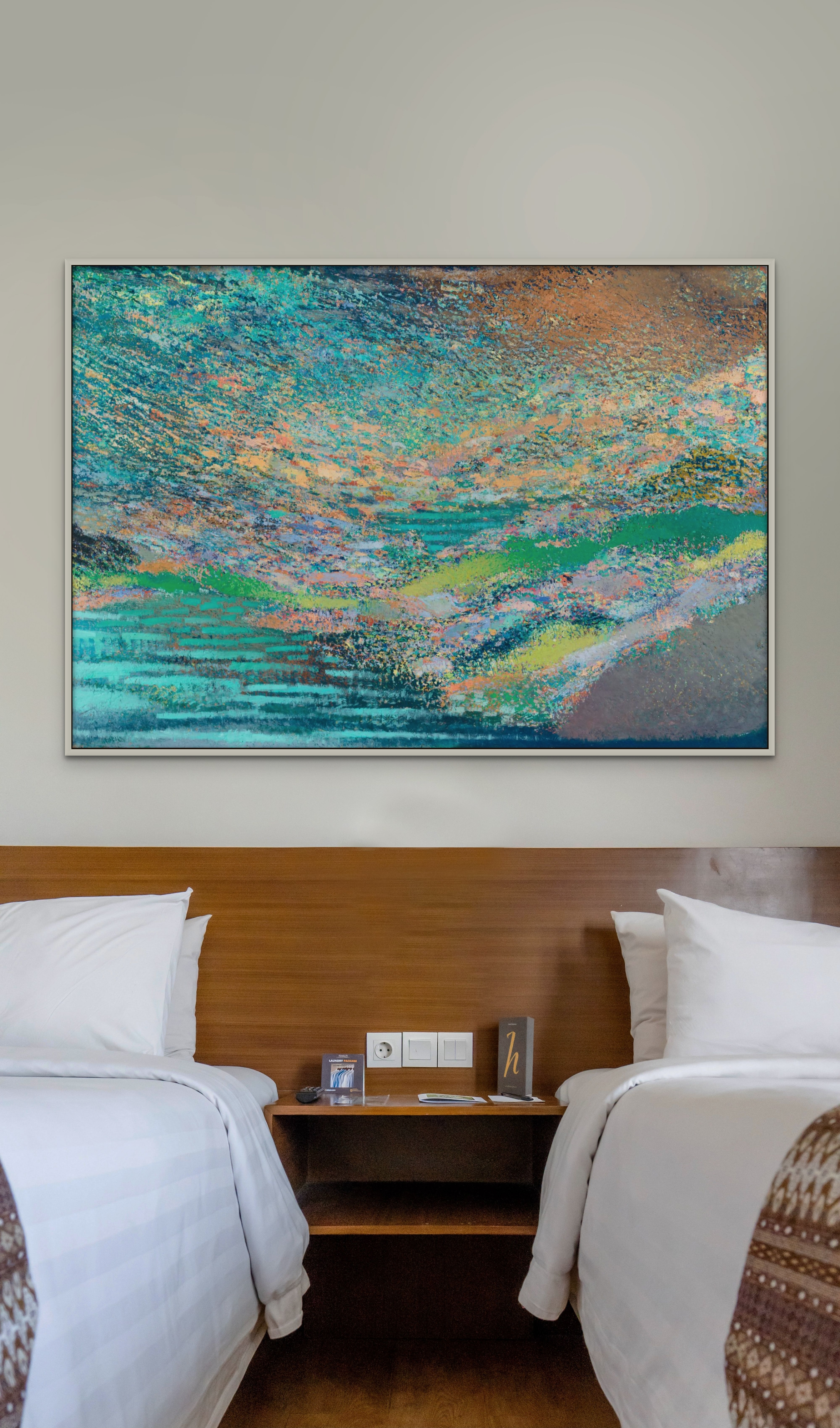 Original large landscape painting for sale in teal and multicolor tones, displayed above beds in a hotel guest room