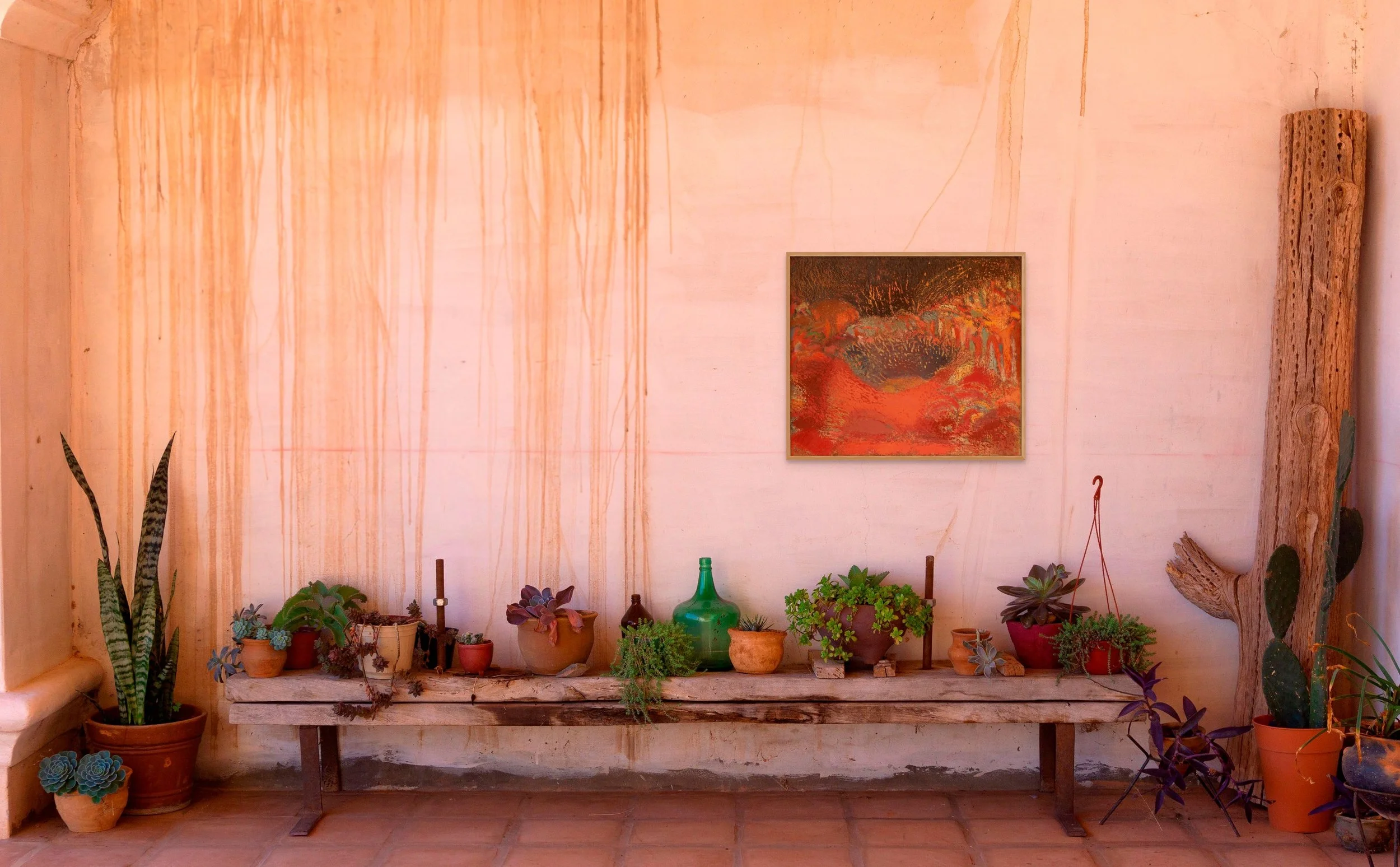 Original landscape painting for sale in warm red tones, displayed on a terracotta wall — view available paintings