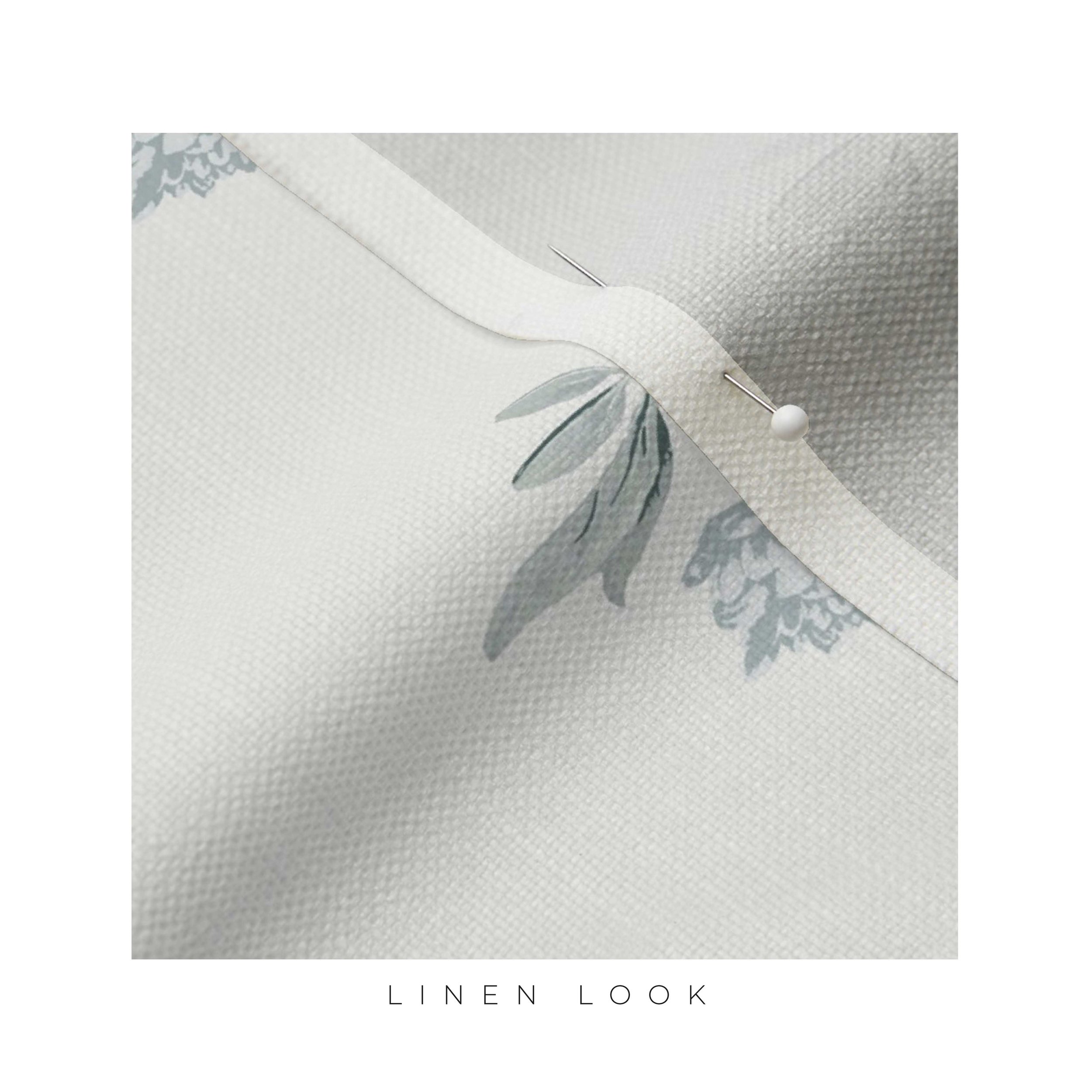 Linen fabric with small flowers block print pattern by surface pattern designer Amy Warr