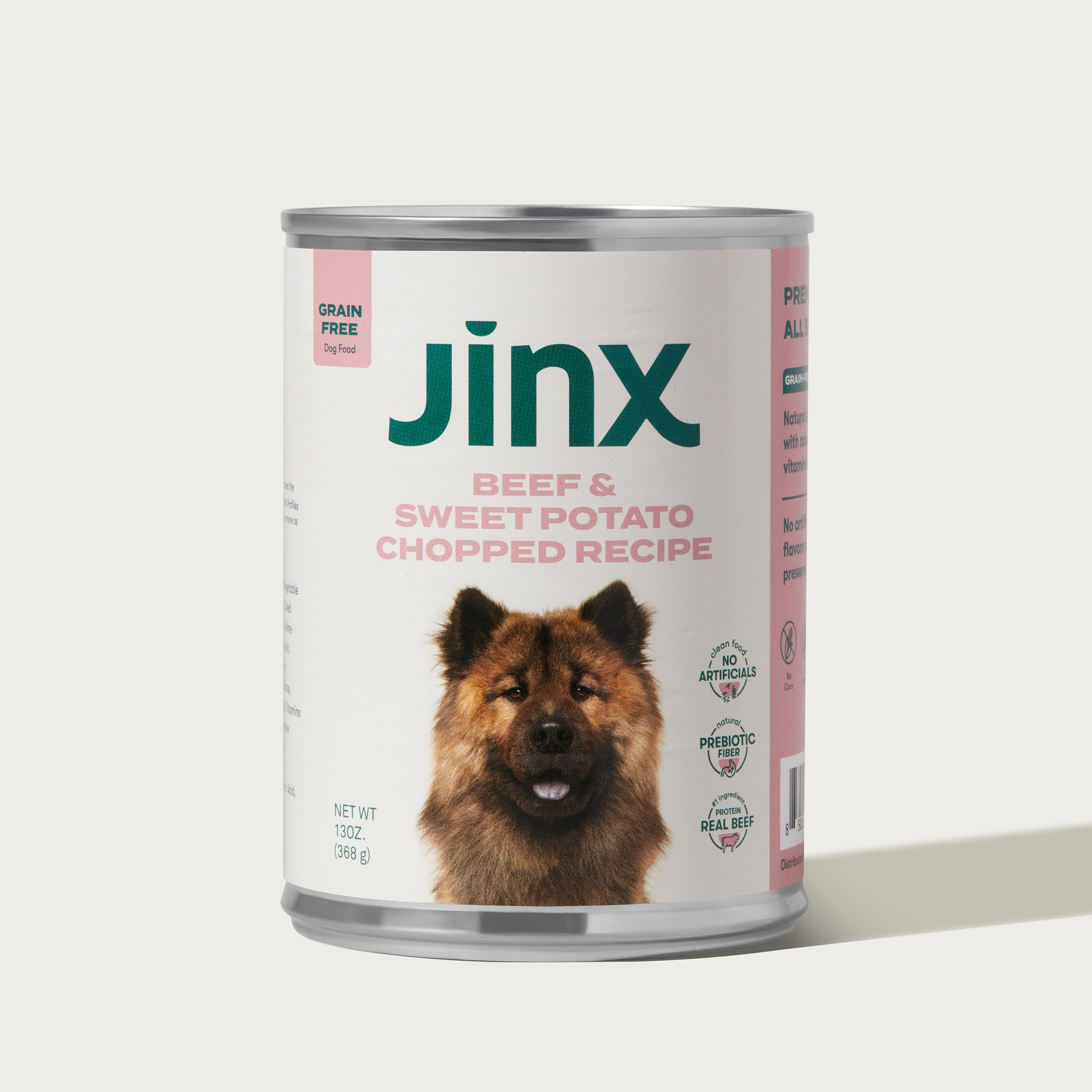 Can of Jinx dog food, beef and sweet potato flavor, with a picture of a dog on the label.